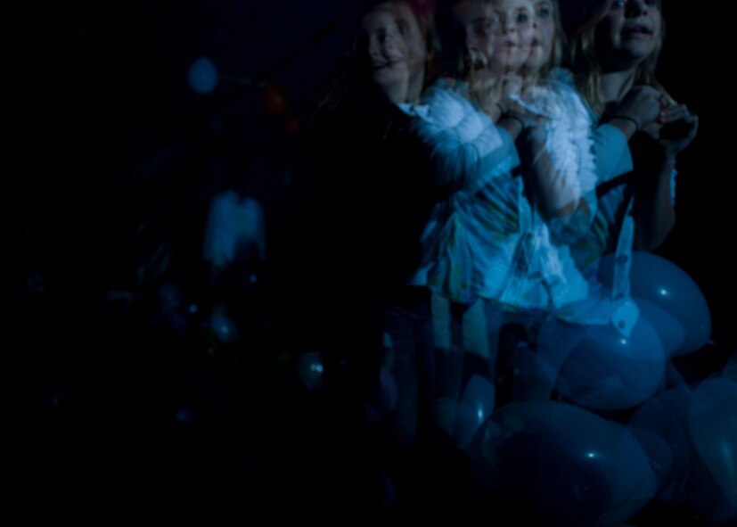 7th Munitions Squadron Haunted House visitors make their way through the party room Oct. 26, 2012, at Dyess Air Force Base, Texas. The haunted house was part of the Fall Carnival held at the Dyess Youth Center, which had games, food and a costume contest. Proceeds from the haunted house went to the youth center. (U.S. Air Force photo by Airman 1st Class Damon Kasberg/ Released)