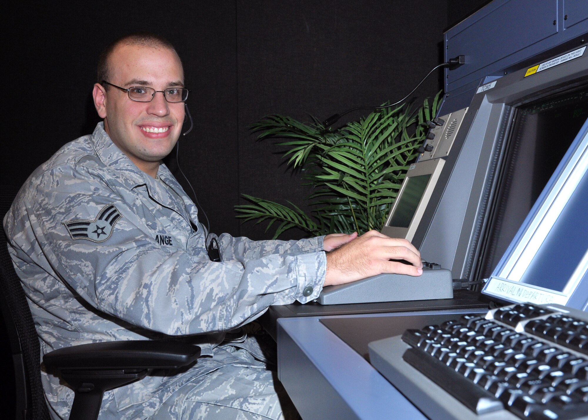 Senior Airman Curtis Lange, 319th Operations Support Squadron air traffic controller, works at the RAPCON (Radar Approach Control) Oct. 30, 2012, on Grand Forks Air Force Base, N.D. Lang said his favorite part of his job is coming to work every day and working with a great group of people as well as dealing with the challenges that come with air traffic control. (U.S. Air Force photo/Airman 1st Class Zachiah Roberson)