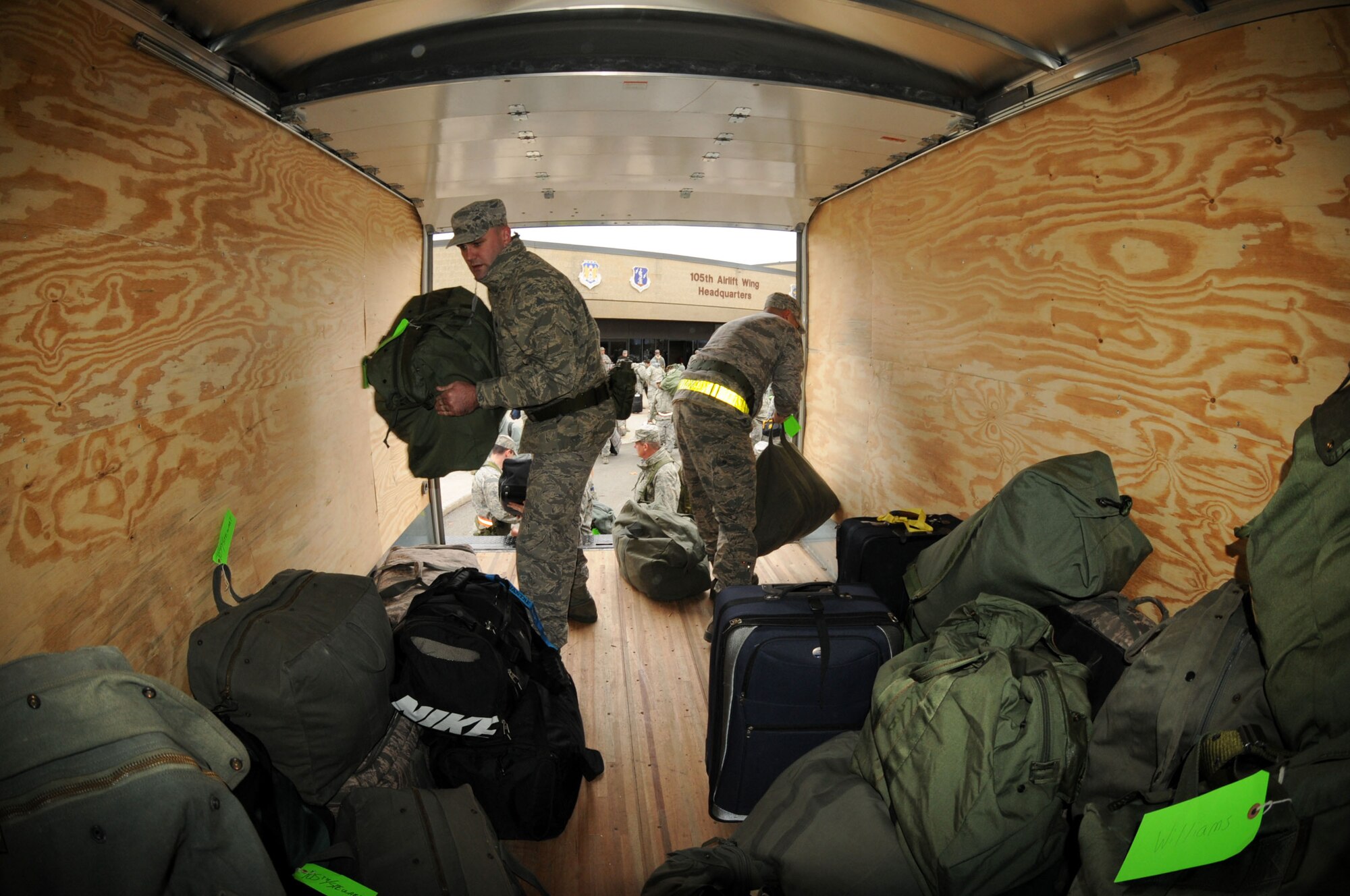STEWART ANGB Newburgh, N.Y. --Staff Sgt's Sean Hughes and Michael Guzman, 105 MXS, loading fellow deployers mobility bags. Members of the 105th Airlift Wing and 213 Engineering Installation Squadron prepare to deploy in response to Hurricane Sandy Wednesday morning Oct. 31, 2012. The Airmen are among more than 2,400 Army and Air National Guard Soldiers and Airmen deployed at the order of Governor Andrew M. Cuomo. The Airmen are part of Joint Operations Area 3, Joint Task Force 3 Hurricane relief operations.