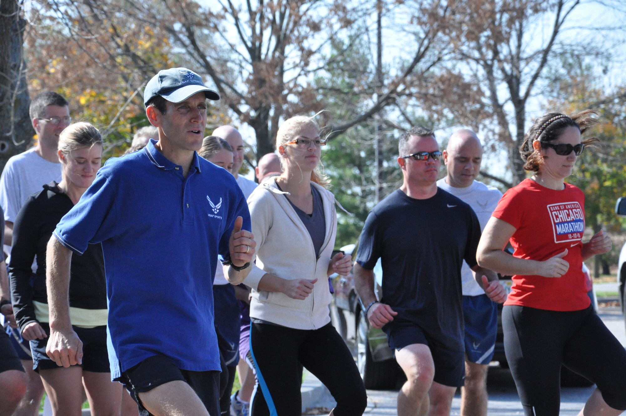 Lt. Col. Mark Cucuzzella, West Virginia University professor of family medicine and two time Air Force Marathon champion teaches the participants of the class how to properly run at the base theater at Scott Air Force Base, Ill. Oct. 25, 2012. Pain from running can be caused from reduced flexibility of the toes and poor running posture. Shoes with heels alter the normal body posture, causing the user to have a more leaned back posture putting more pressure on the joints instead of the muscles. (U.S. Air Force photo/Airman 1st Class Jake Eckhardt)