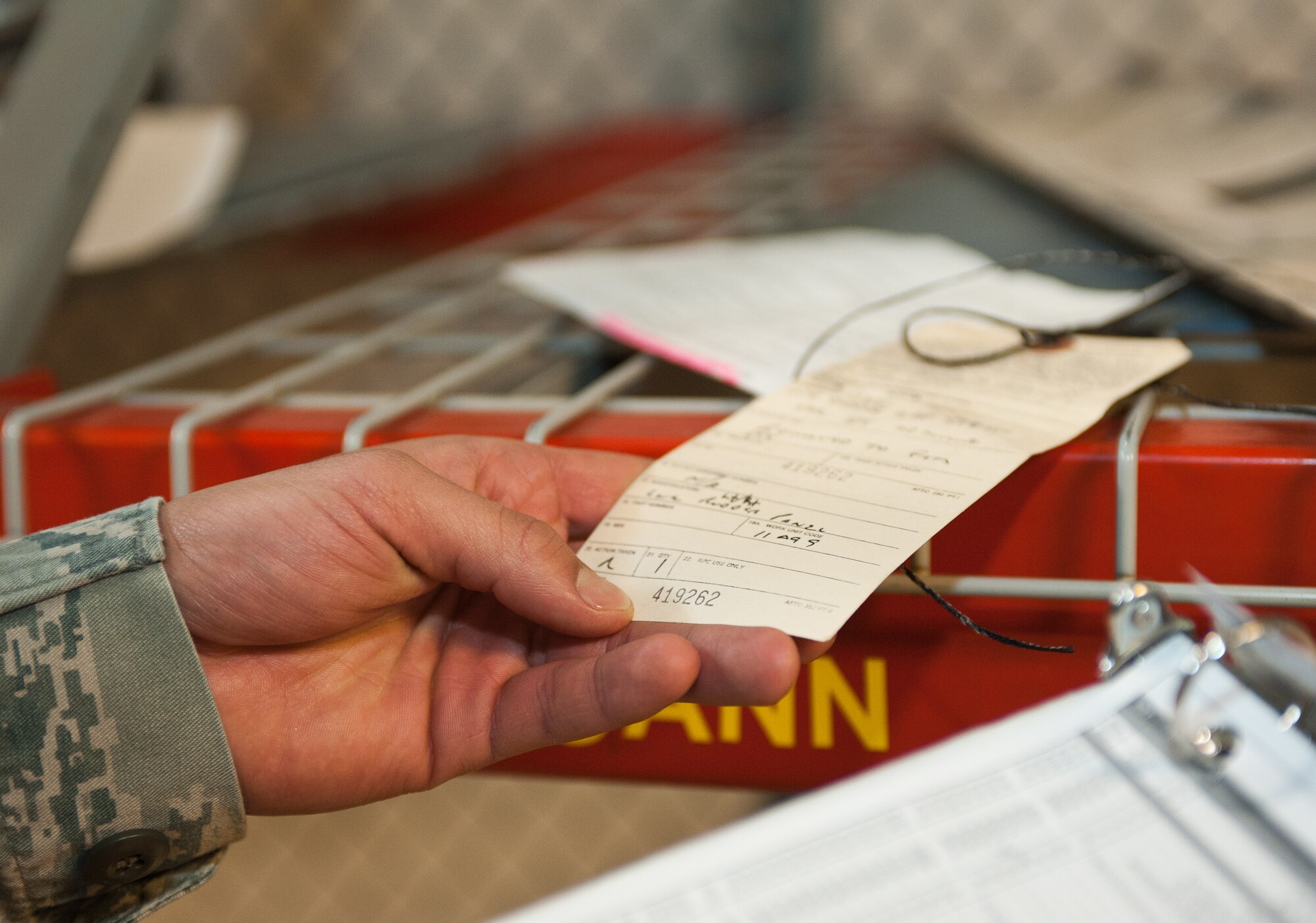 Senior Airman Irvin Vazquez-Casanova, 28th Aircraft Maintenance Squadron combat oriented supply organization technician, checks a part tag to ensure accountability at Ellsworth Air Force Base, S.D., Oct. 25, 2012. The hundreds of items stored in the 28th AMXS COSO shop must be labeled properly to be easily tracked and found. (U.S. Air Force photo by Airman 1st Class Alystria Maurer/Released)
