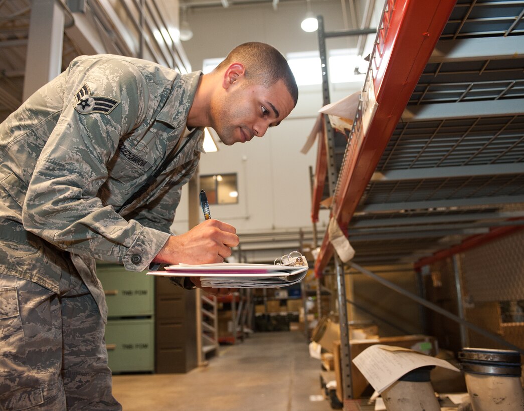 Senior Airman Irvin Vazquez-Casanova, 28th Aircraft Maintenance Squadron combat oriented supply organization technician, reviews part numbers while performing an inspection at Ellsworth Air Force Base, S.D., Oct. 25, 2012. Each part number must be checked and verified in the parts database to ensure accurate accountability.  (U.S. Air Force photo by Airman 1st Class Alystria Maurer/Released)