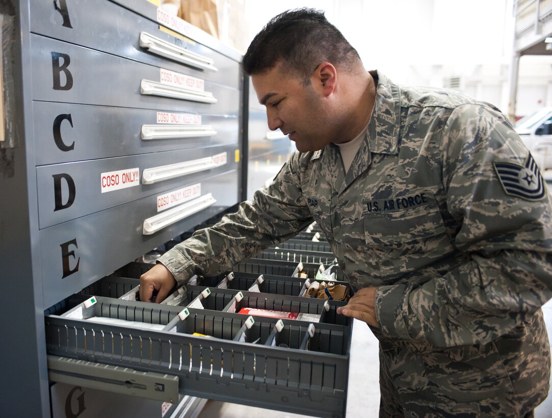 Tech. Sgt. Eric Piar, 28th Aircraft Maintenance Squadron combat oriented supply organization NCO in charge, gathers bench stock items for maintainers at Ellsworth Air Force Base, S.D., Oct. 25, 2012. The 28th AMXS COSO shop is responsible for storing and supplying commonly used aircraft parts to have on hand for maintenance personnel. (U.S. Air Force photo by Airman 1st Class Alystria Maurer/Released)
