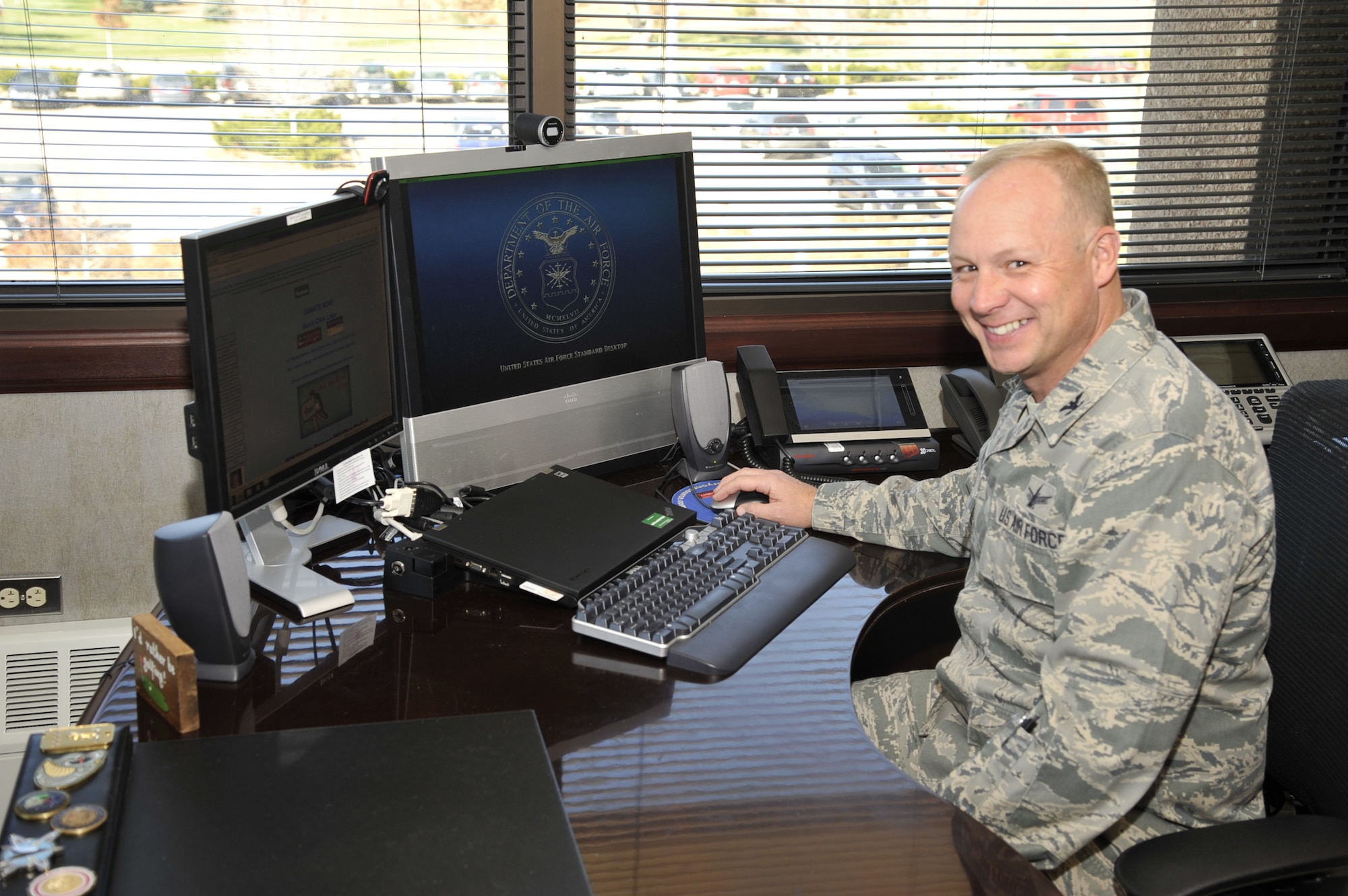 PETERSON AIR FORCE BASE, Colo. -- Col. Chris Crawford, 21st Space Wing commander, signs his Combined Federal Campaign form on the Pikes Peak CFC website. This year’s CFC theme is “Get Your Give Online,” to encourage everyone to donate to their chosen charities online rather than using the paper forms. The goal for the 21st SW is $320,000 in donations and 25 percent participation. To donate to the CFC, go to https://www.cfcnexus.org/_peakcfc/. (U.S. Air Force photo/Robb Lingley)