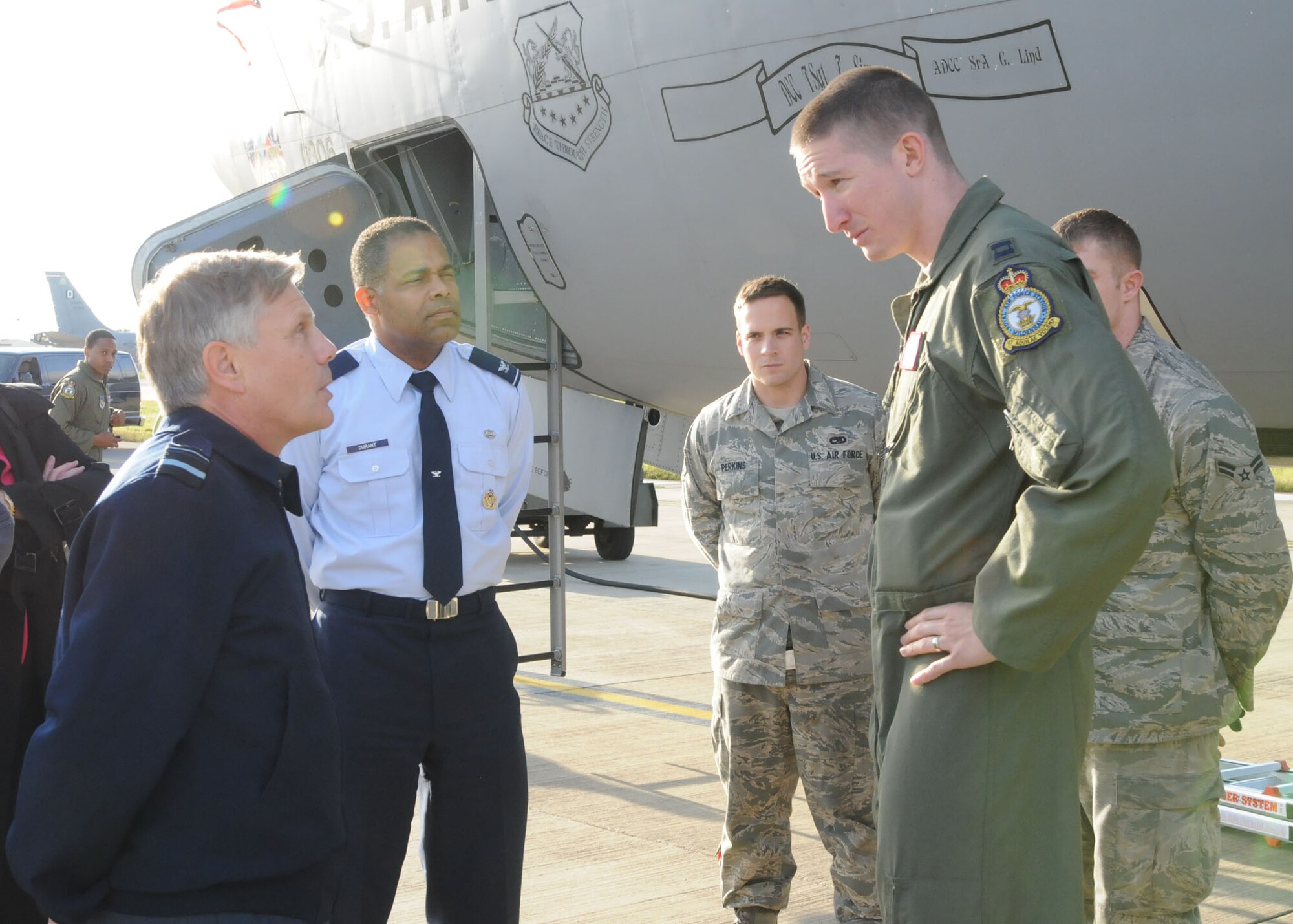 Right, Capt. Bruce Jamison, 351st Air Refueling Squadron pilot, discusses the architecture of a KC-135 Stratotanker to left, Air Vice-Marshal Lindsay Irvine, Director of Legal Services Royal Air Force Oct. 30, 2012 at RAF Mildenhall, England. Irvine toured RAF Mildenhall and RAF Lakenheath during his visit of the tri-base area. (U.S. Air Force photo by Airman 1st Class Kelsey Waters/Released)
