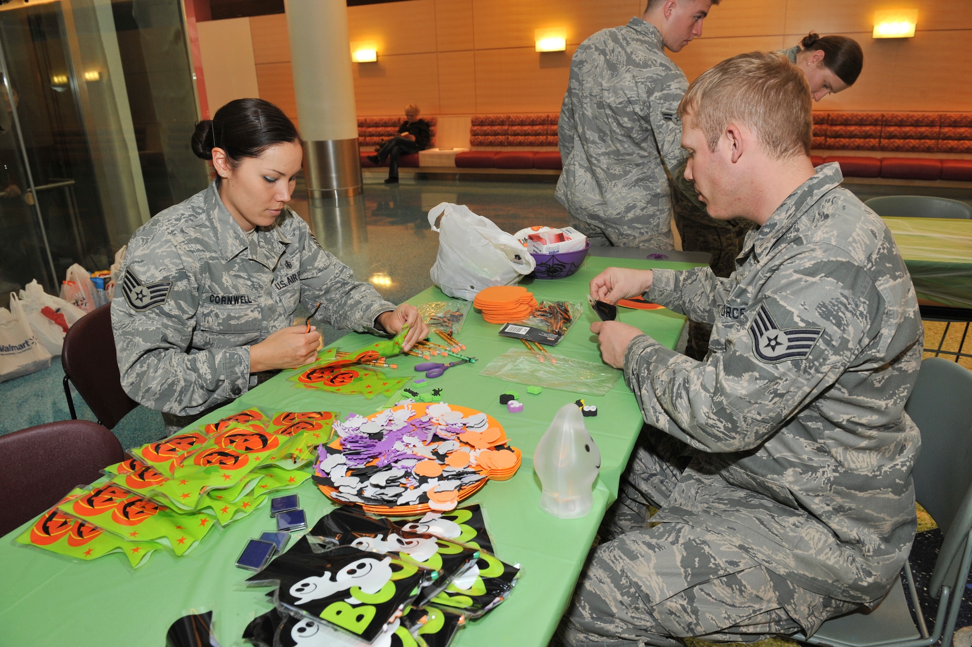 AURORA, Colo. – Staff Sgts. Katherine Cornwell and Jared Stout, both 2nd Space Warning Squadron orbital analysts, prepare treat bags for children at the Children’s Hospital Colorado Oct. 29, 2012. Thirteen Team Buckley members provided treats, played games and assisted with crafts to bring Halloween spirit to more than 50 children at the hospital, many of whom are unable to trick or treat this year. (U.S. Air Force photo by Airman 1st Class Phillip Houk)