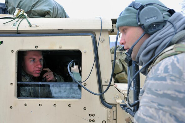 Airmen First Class Travis Lowe, 2nd Air Support Operations Squadron tactical air control party member, coordinates an air strike with Spangahlem Air Base’s A10s over the radio during the Joint Mission Readiness Exercise in Hohenfels, Germany, Oct. 29, 2012. Main goal of the exercise was to practice integration with the Army and hone skills on force on force land operations. (U.S Air Force photo/Senior Airman Caitlin O’Neil-McKeown) 