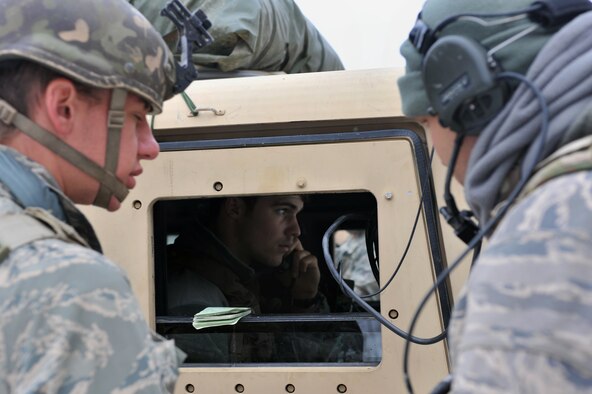 Airman First Class Michael Tagariello, 2nd Air Support Operations Squadron tactical air control party member, coordinates an air strike with Spangahlem Air Base’s A10s over the radio during the Joint Mission Readiness Exercise in Hohenfels, Germany, Oct. 29, 2012. Main goal of the exercise was to practice integration with the Army and hone skills on force on force land operations. (U.S Air Force photo/Senior Airman Caitlin O’Neil-McKeown)