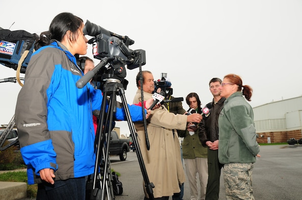 75 members of the 107th Airlift Wing have deployed downstate to aid in Hurricane Sandy recovery efforts. 1st Lt. Cory Bota and Master Sgt. Laura Thomas are interviewed with the local press about their deployment to New York City. Oct. 30, 2012 (National Guard Photo/Senior Master Sgt. Ray Lloyd)
