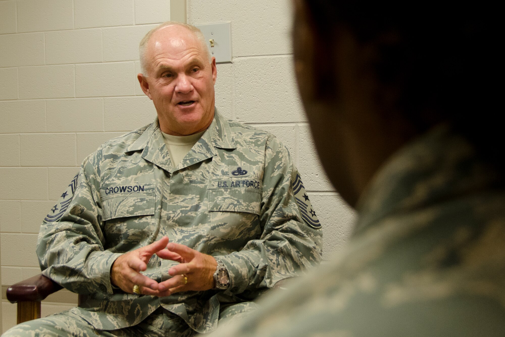 Chief Master Sgt. Larry Crowson, the South Carolina State Command Chief talks with Airmen in his office at McEntire Joint National Guard Base, S.C., Oct. 16, 2012. Crowson represents region 4 on the Enlisted Field Advisory Council, which meets three-to-four times a year to propose changes, solutions and other policy actions that imapact the 94,000 enlisted members of the Air National Guard. (National Guard photo by Master Sgt. Marvin Preston/RELEASED)