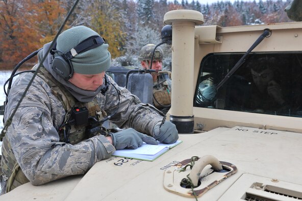 A member of the 2nd Air Support Operations Squadron tactical air control party member, coordinates a call to A10s from Spangahlem Air Base for air support during the Joint Mission Readiness Exercise in Hohenfels, Germany, Oct. 29, 2012. Main goal of the exercise was to practice integration with the Army and hone skills on force on force land operations. (U.S Air Force photo/Senior Airman Caitlin O’Neil-McKeown)