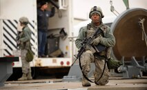 MISSILE COMPLEX, N.D. -- Airman 1st Class Tavarus Roberts, 791st Missile Security Forces Squadron response force leader, guards a missile site as part of a maintenance security escort team, Oct. 23. Site security is a top priority during facility maintenance. (U.S. Air Force photo/Senior Airman Jose L. Hernandez)