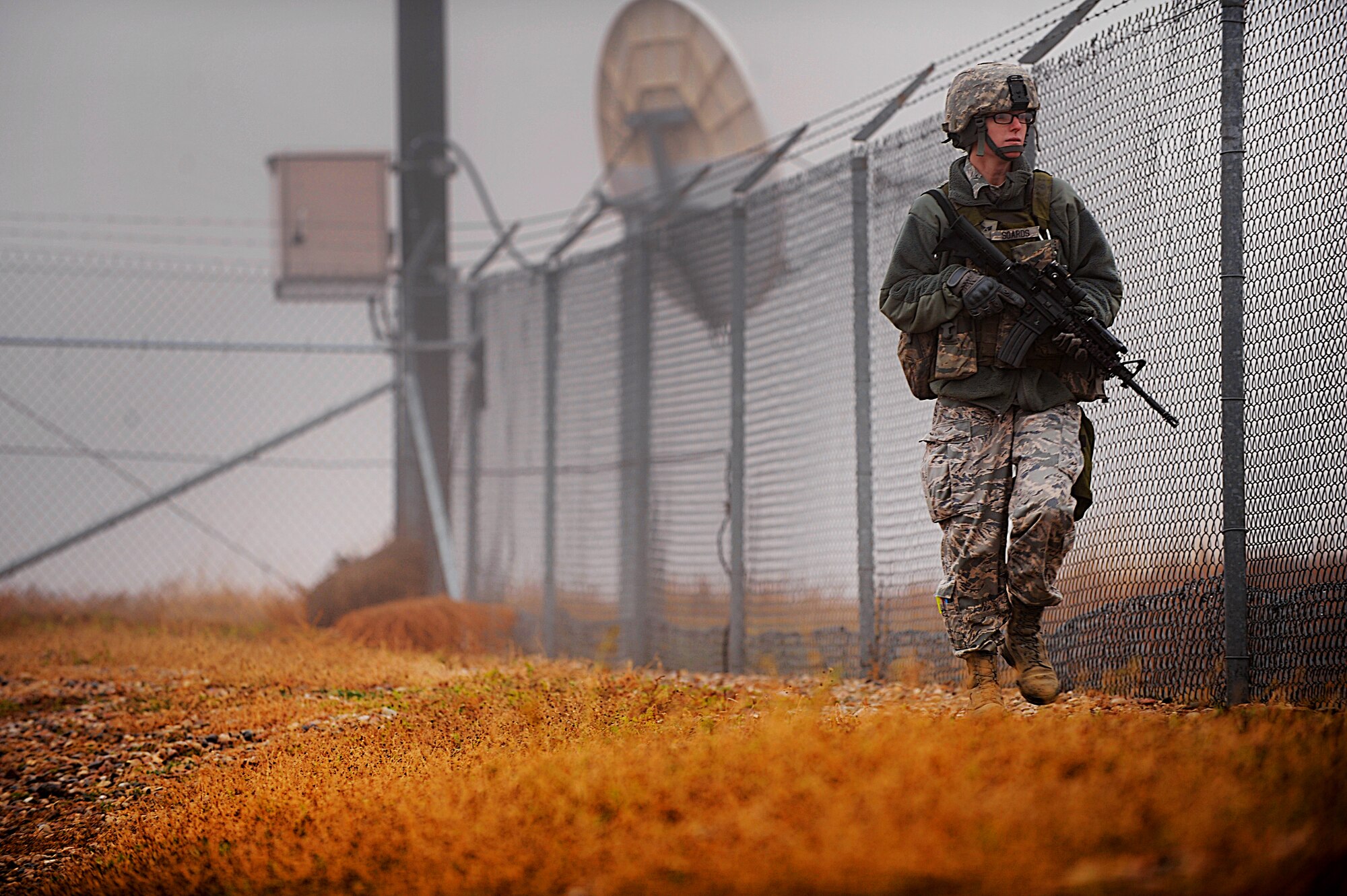 MISSILE COMPLEX, N.D. -- Senior Airman Summer Soards, 791st Missile Security Forces Squadron response force leader, conducts a security perimeter check at a launch facility, Oct. 22. As a member of the squadron's maintenance security escort teams, Soards is responsible for overseeing the security of  sites when the facility is undergoing maintenance. (U.S. Air Force photo/Senior Airman Jose L. Hernandez)