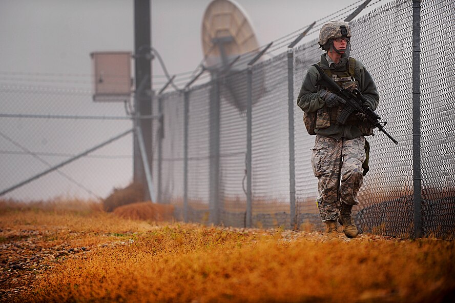 MISSILE COMPLEX, N.D. -- Senior Airman Summer Soards, 791st Missile Security Forces Squadron response force leader, conducts a security perimeter check at a launch facility, Oct. 22. As a member of the squadron's maintenance security escort teams, Soards is responsible for overseeing the security of  sites when the facility is undergoing maintenance. (U.S. Air Force photo/Senior Airman Jose L. Hernandez)