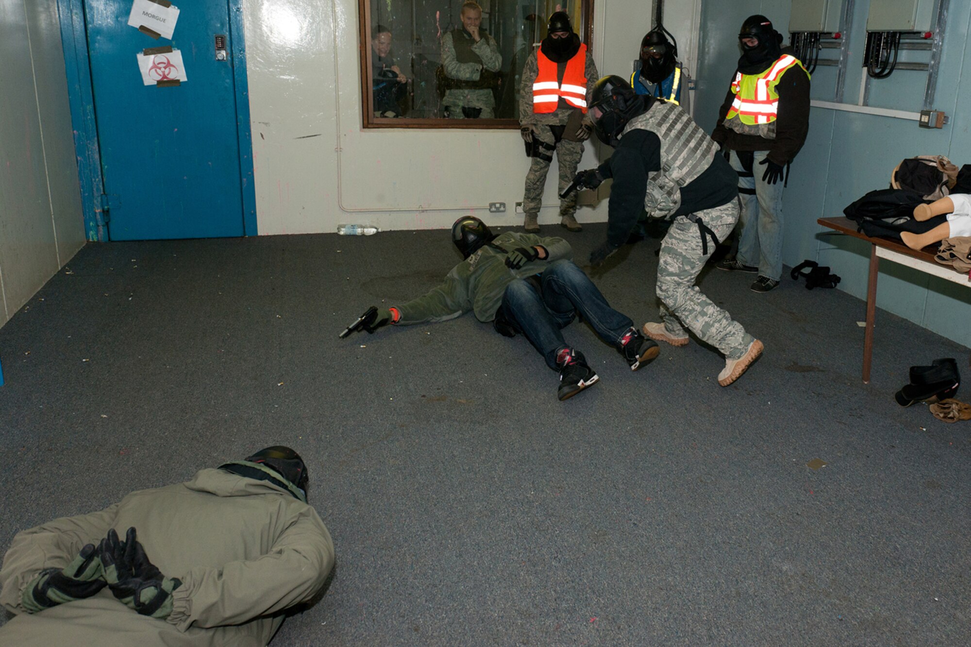 RAF MOLESWORTH, United Kingdom – Staff Sgt. Joseph Burks, 423rd Security Forces Squadron, terminates a hostile/armed suspect as part of a training exercise during a Simmuntions Instructor's Course at RAF Molesworth Oct. 23. Members of the 423rd SFS at RAF Alconbury, 422nd SFS at RAF Croughton, 48th SFS at RAF Lakenheath and 100th SFS at RAF Mildenhall learned how to handle duty weapons and Simmuntions safely during the two-day course. (U.S. Air Force photo by Staff Sgt. Brian Stives)