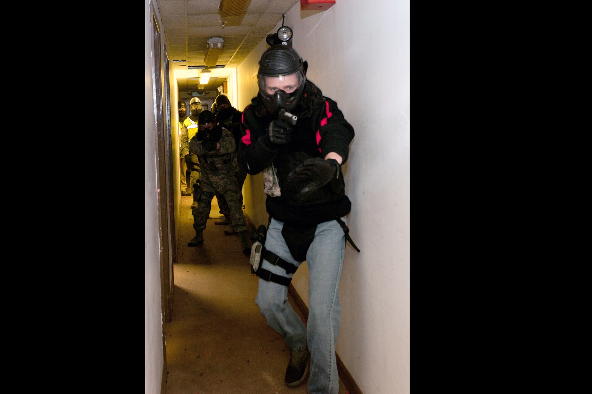 RAF MOLESWORTH, United Kingdom – Members of the 422nd Security Forces Squadron perform room clearing procedures during a Simmuntions Instructor's Course at RAF Molesworth Oct. 23. Members of the 423rd SFS at RAF Alconbury, 422nd SFS at RAF Croughton, 48th SFS at RAF Lakenheath and 100th SFS at RAF Mildenhall learned how to handle duty weapons and Simmuntions safely during the two-day course. (U.S. Air Force photo by Staff Sgt. Brian Stives)
