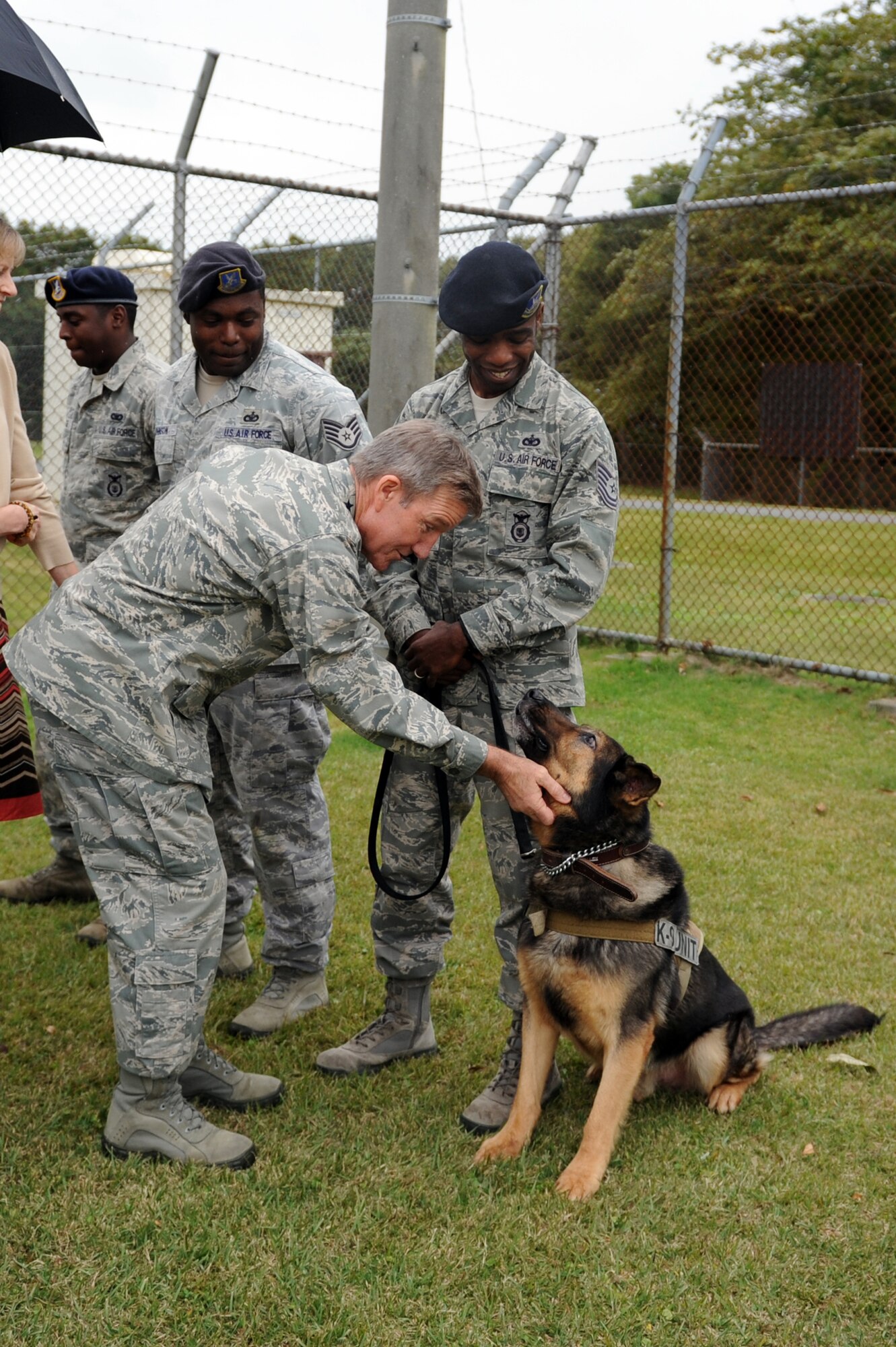 U.S. Air Force Gen. Herbert J. "Hawk" Carlisle, Pacific Air Forces commander, pets Ajo, 35th Security Forces Squadron military working dog, after a K-9 aggression demonstration during his first visit at Misawa Air Base, Japan, Oct. 25, 2012. Carlisle toured several units within the 35th Fighter Wing and met with Airmen, Japan Air Self-Defense Force leadership and the Misawa City mayor to discuss numerous topics during his visit to Misawa. (U.S. Air Force photo/Airman 1st Class Kia Atkins)
