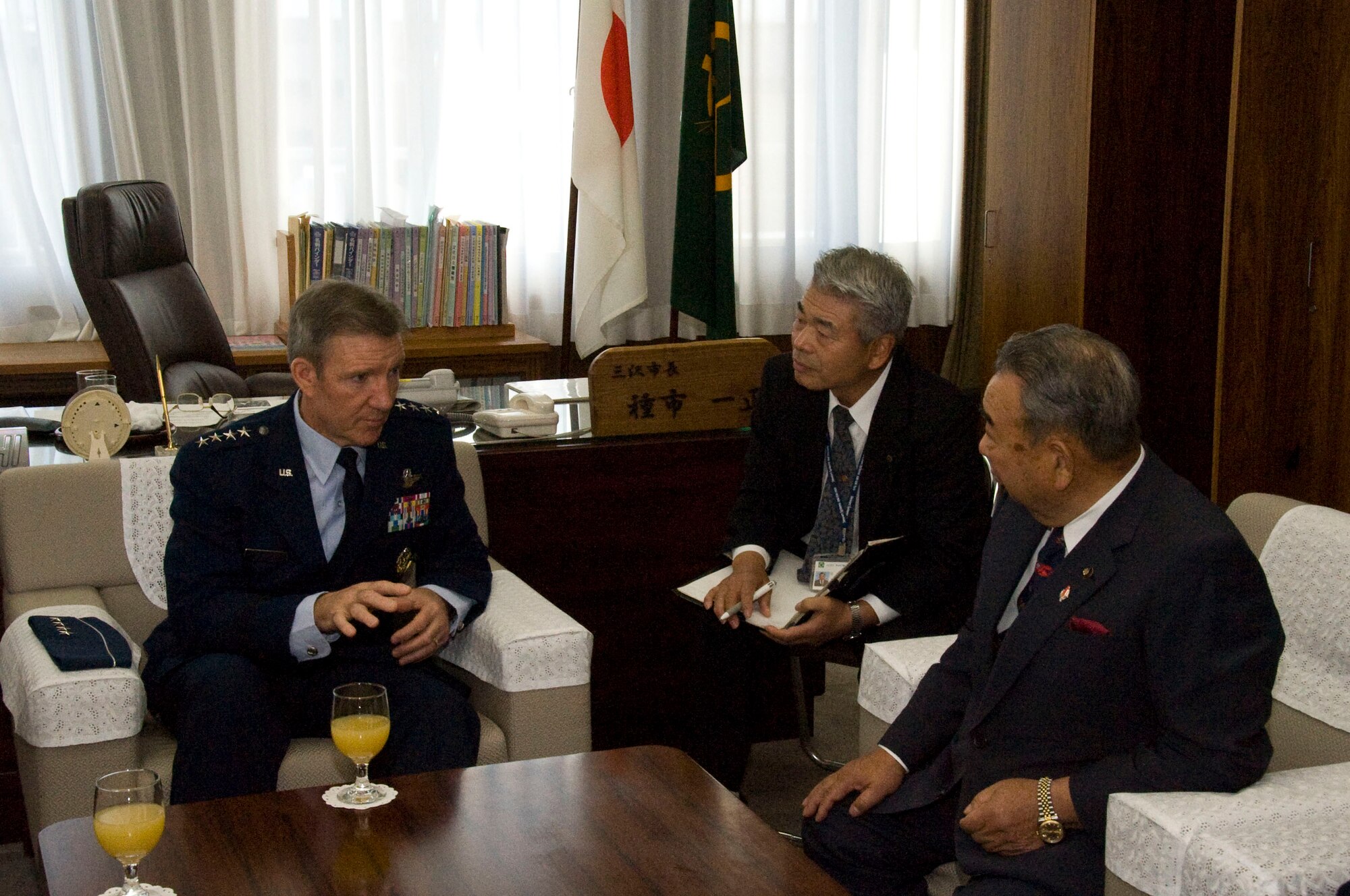 U.S. Air Force Gen. Herbert Carlisle, left, Pacific Air Forces commander, speaks to Kazumasa Taneichi, Misawa City mayor, at Misawa City, Japan, Oct. 25, 2012. Carlisle thanked the Japanese people for their continued support and willingness to maintain their strong bilateral relationship despite recent incidents. (U.S. Air Force photo/Airman 1st Class Kenna Jackson)
