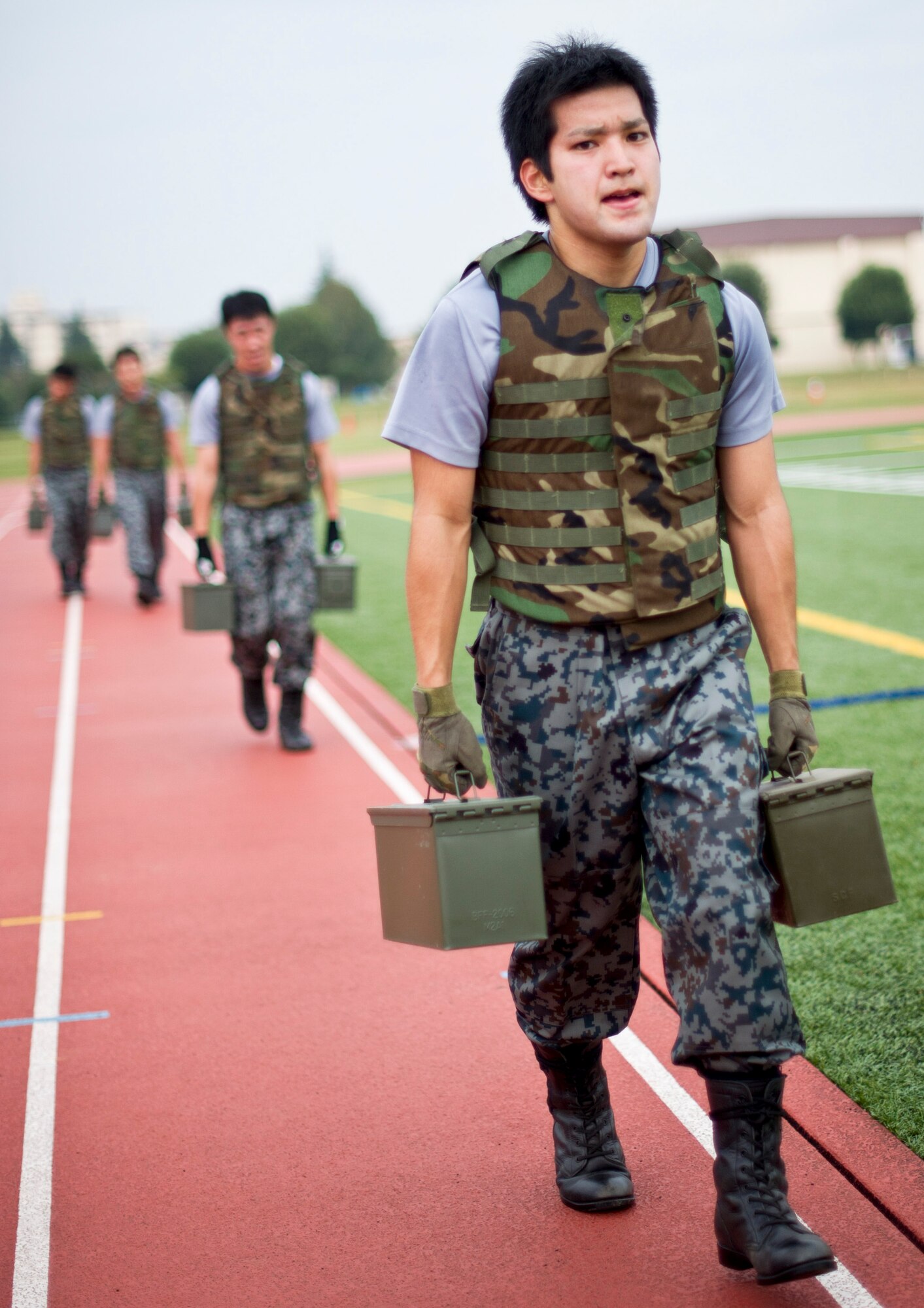 YOKOTA AIR BASE, Japan -- Members from the Japan Air Self-Defense Force participate in the ammunitions can carry during the 4th Annual Combat Endurance Challenge at Yokota Air Base, Japan, Oct. 27, 2012. This was the second year JASDF Airmen participated. (U.S. Air Force photo by Staff Sgt. Stacy Moless)