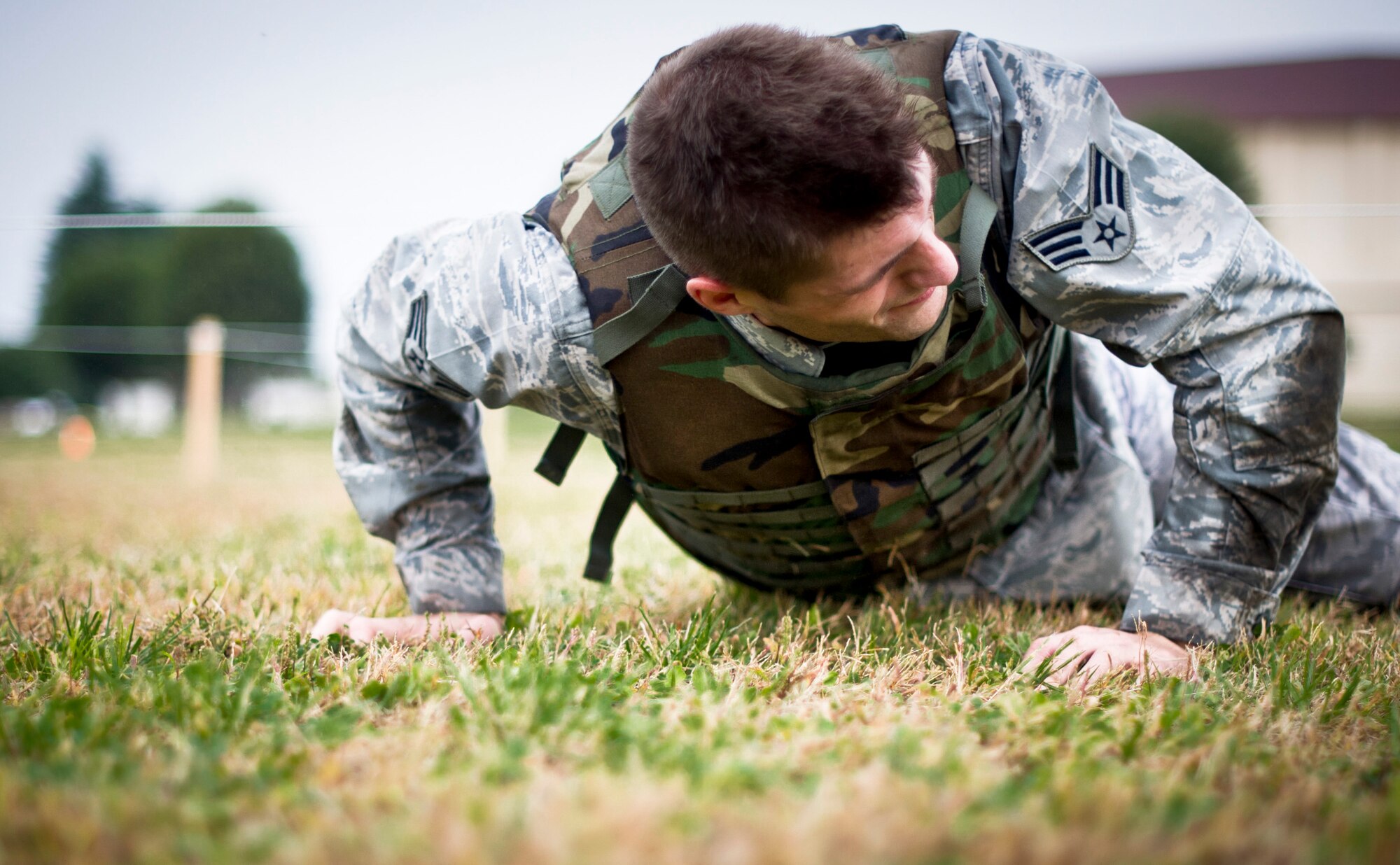 YOKOTA AIR BASE, Japan -- Senior Airman Andrew Biehl, 730th Air Mobility Squadron, performs a 25-yard low crawl during the 4th Annual Combat Endurance Challenge at Yokota Air Base, Japan, Oct. 27, 2012. The task locations were spaced apart from each other, forcing the teams to run to each station and adding to the physical demands of the challenge. (U.S. Air Force photo by Staff Sgt. Stacy Moless)