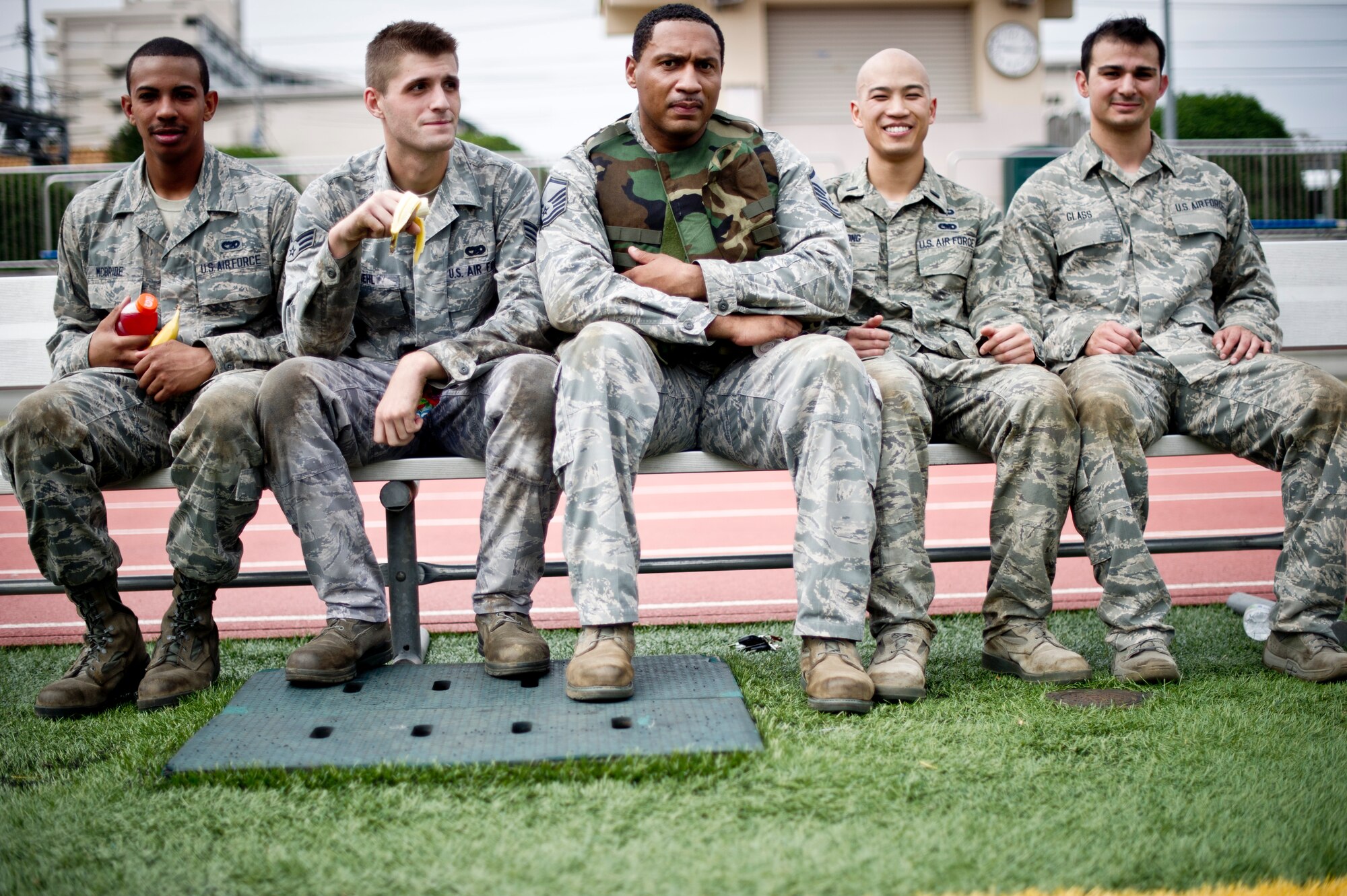YOKOTA AIR BASE, Japan -- A team from the 730th Air Mobility Squadron takes a break after completing the 4th Annual Combat Endurance Challenge at Yokota Air Base, Japan, Oct. 27, 2012. As the host of the event, the 730 AMS team was the first to undertake the course which tested their strength and teamwork. The 730 AMS held the event to honor those who fell on Sept. 11, 2001. (U.S. Air Force photo by Staff Sgt. Stacy Moless)