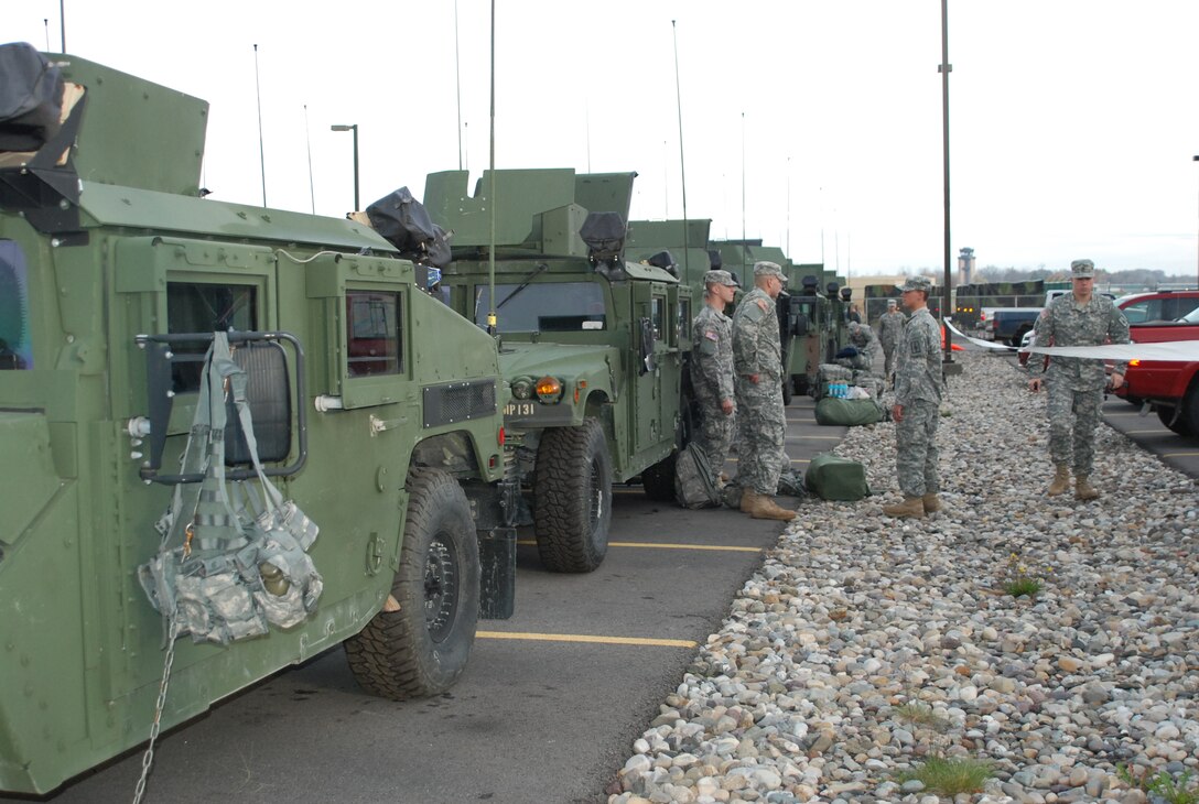 New York Army National Guard soldiers prepare to move out on a road march from New York State Division of Military and Naval Affairs Headquarters to the  Farmingdale Armed Forces Reserve Center as part of the New York state response to Hurricane Sandy, Latham, N.Y., Oct. 28, 2012.  The soldiers are among more than 1,100 Army and Air National Guard soldiers and airmen deployed at the order of New York Gov. Andrew M. Cuomo to respond to the storm. The soldiers are assigned to the 206th Military Police Company.