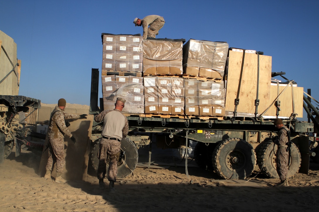 U.S. Marines unload supplies in preparation for a 32-hour combat logistics patrol on Camp Leatherneck in Helmand province, Afghanistan, Oct. 24, 2012. The Marines are assigned to the Combat Logistics Battalion 2, Combat Logistics Regiment 15. The convoy delivered food, water, construction materials and surveillance equipment to Marines assigned to the 2nd Battalion, 7th Marines spread across three forward operating bases in Helmand province.