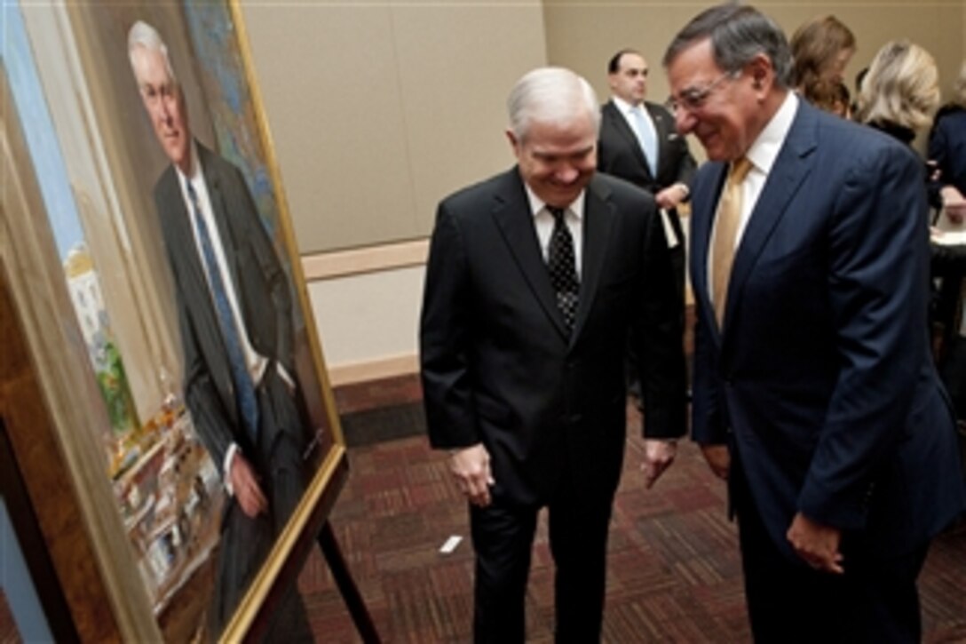 Secretary of Defense Leon E. Panetta, right, and former Secretary of Defense Robert M. Gates, left, share a laugh at the portrait unveiling ceremony for Gates at the Pentagon on Oct. 29, 2012.  Gates was the 22nd secretary of defense.  