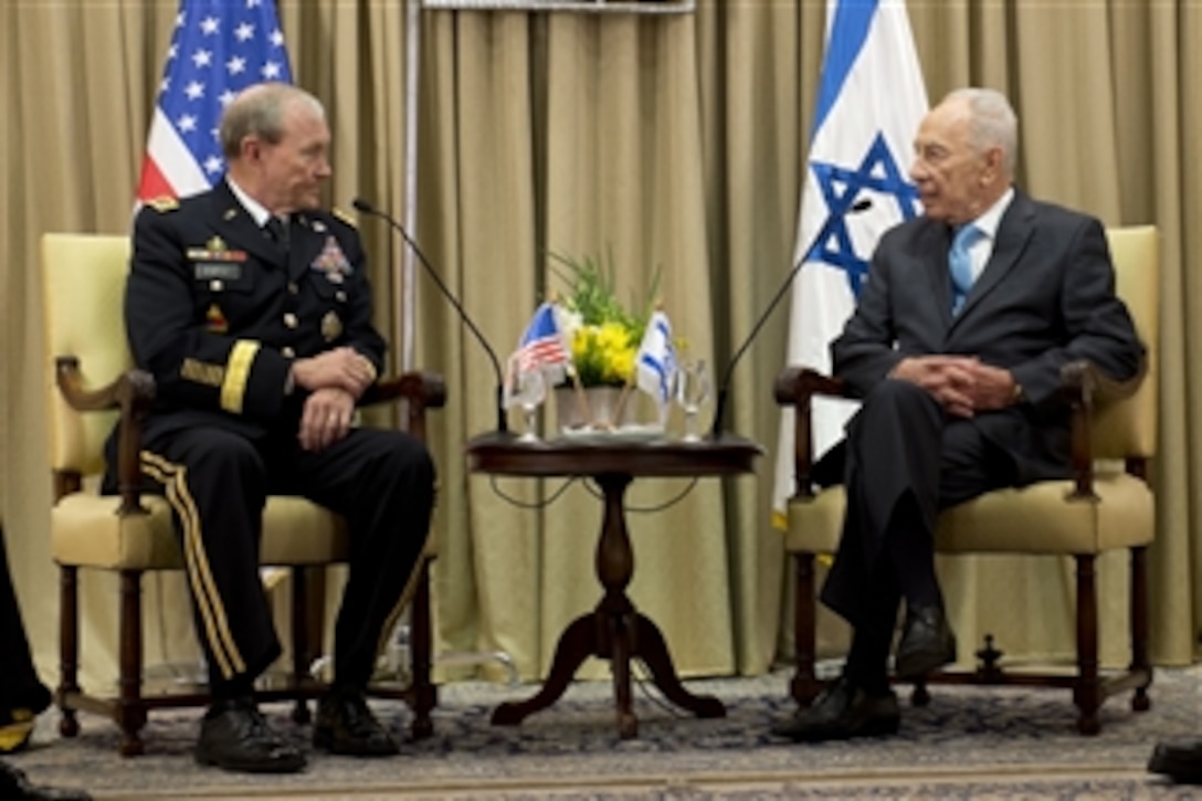Israel President Shimon Peres, right, meets with Chairman of the Joint Chiefs of Staff Gen. Martin E. Dempsey in Jerusalem, Israel, on Oct. 29, 2012.  Dempsey is in Israel to meet with senior leaders and to observe Exercise Austere Challenge 2012, the largest U.S.-Israeli military exercise to date