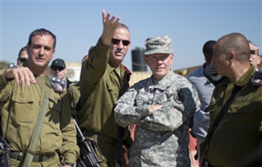 Israeli Chief of Defense Lt. Gen. Benny Gantz, second from left, briefs Chairman of the Joint Chiefs of Staff Gen. Martin E. Dempsey, second from right, about aspects of the Iron Dome at a military installation in Israel on Oct. 30, 2012.  Dempsey is in Israel to meet with senior leaders and to observe Exercise Austere Challenge 2012, the largest U.S.-Israeli military exercise to date.  