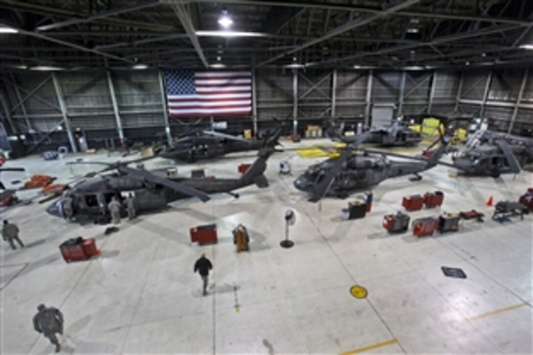 Soldiers prepare UH-60 Black Hawk helicopters for further search and rescue missions on Joint Base McGuire-Dix-Lakehurst, N.J., Oct. 30, 2012, following the passing of Hurricane Sandy. The soldiers are assigned to the 1-150th Assault Helicopter Battalion, New Jersey Army National Guard.
