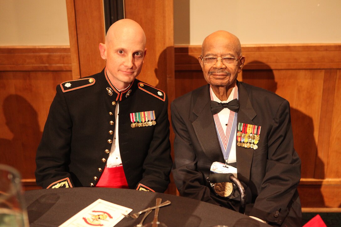 Lt. Col. Jesse A. Kemp, the commanding officer of 2nd Supply Battalion, 2nd Marine Logistics Group, shares a spot at the head table with Turner G. Blount, one of the original members of the Montford Point Marines, during the battalion’s Marine Corps Birthday ball in New Bern, N.C., Oct. 29, 2012. The battalion invited the Montford Point Marines to join in the festivities and to honor them for their unique contribution to the unit’s history. 