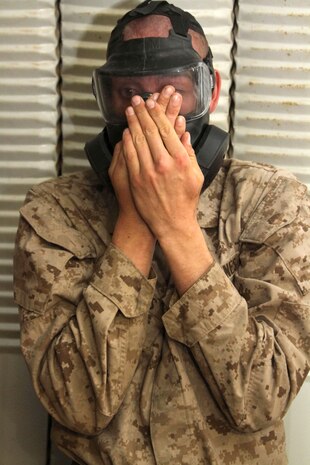 A recruit of Company K, 3rd Recruit Training Battalion, clears his M50 Joint Service General Purpose Mask after being exposed to CS gas in the Confidence Chamber aboard Marine Corps Base Camp Pendleton, Calif., Oct. 26. Recruits learn how to don and properly clear a mask in case they were to be exposed to a chemical agent.
