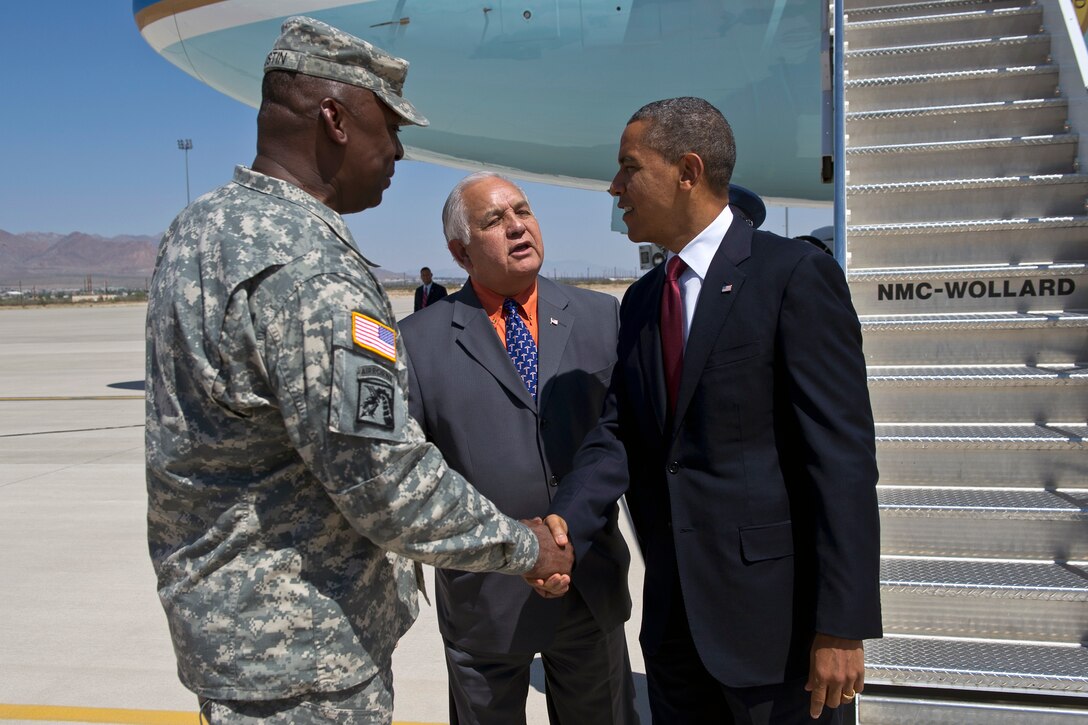U.S. Rep. Silvestre Reyes, of Texas, center, and Army Gen. Lloyd Austin, Army vice chief of staff, left, greet President Barack Obama upon his arrival to Fort Bliss, Texas, Aug. 31, 2012. 
