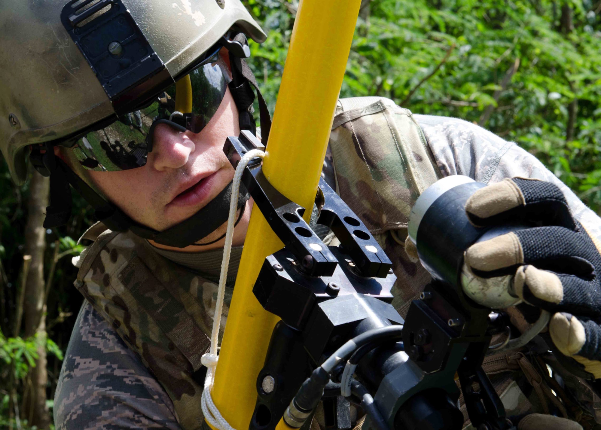 NAVAL BASE GUAM, Guam-- Staff Sgt. Josef Miller, 36th Civil Engineer Squadron explosive ordnance disposal flight team lead, attaches an extension to a Talon robot during Tri-Crab 2012. Tri-Crab is a two-week multinational exercise designed to strengthen relationships and interoperability with the U.S.