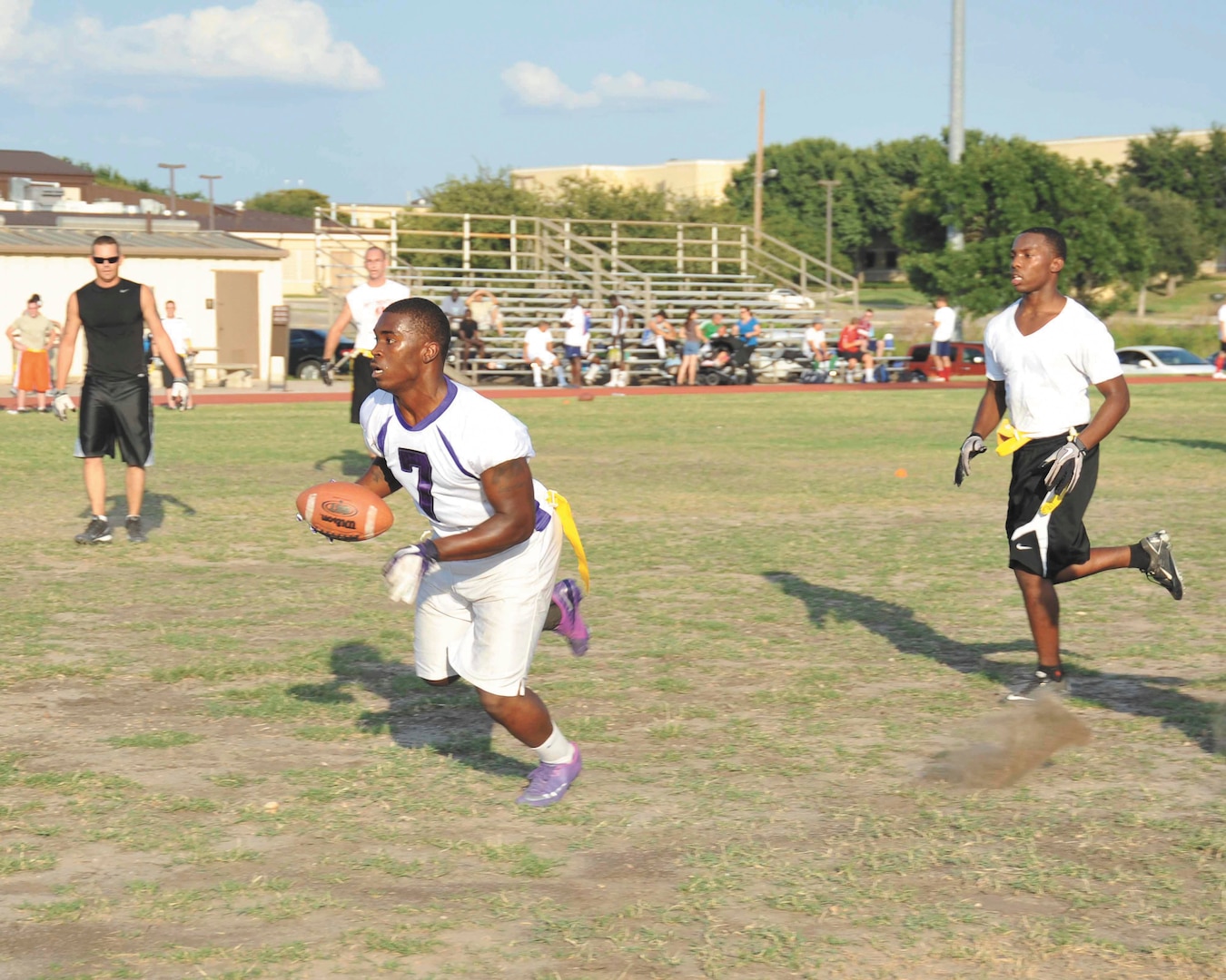 59th Dental Squadron wide receiver Nakeithian Phillips runs down field during a scrimmage game Aug. 23. The squad is preparing to defend its Joint Base San Antonio intramural flag football title. (U.S. Air Force photo/Alan Boedeker)