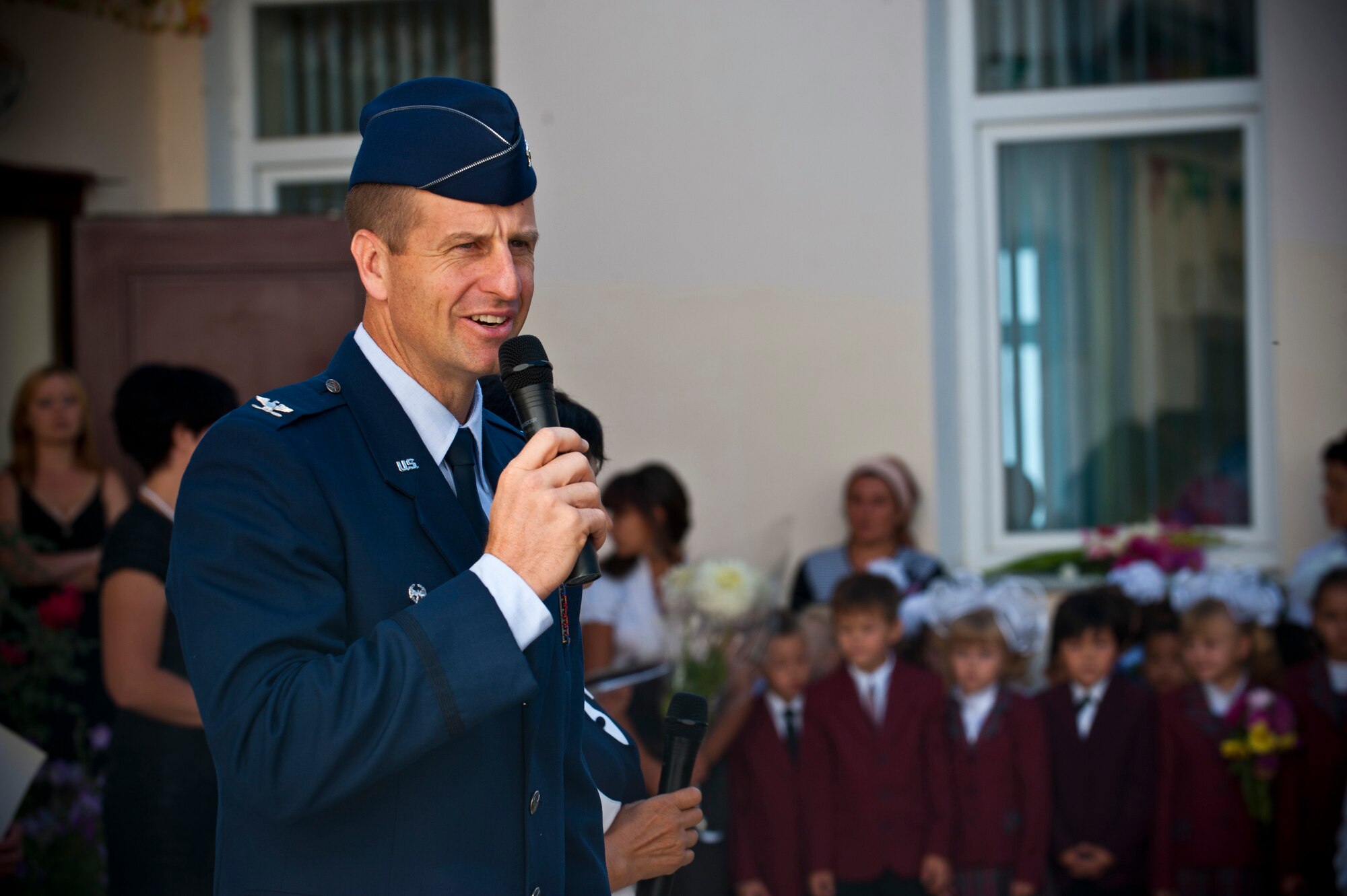 Col. Corey Martin, Transit Center at Manas director, shares remarks during the "First Bell" ceremony at the Birdik Elementary School in Bishkek, Kyrgyzstan, Sept. 1, 2012. Martin thanked parents and teachers for their dedication and hard work for providing education to the children. (U.S. Air Force photo/Senior Airman Brett Clashman)