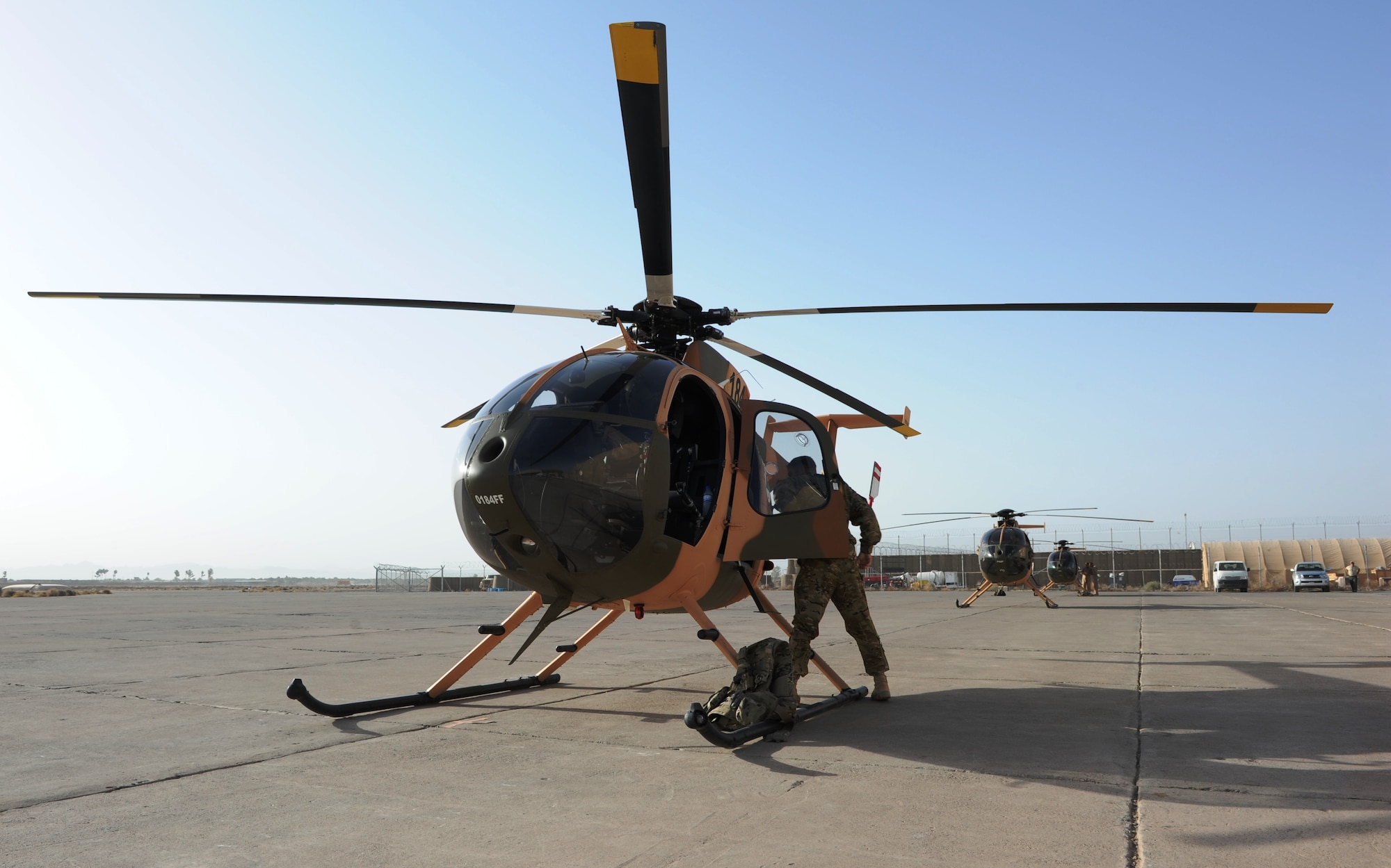 Four Afghan Air Force flight students from class 91-02 and their U.S. instructors prepare to fly the MD-530F during undergraduate helicopter training Aug.29, 2012, Shindand Air Base, Afghanistan. This is the four students’ second flight; they are expected to graduate from their course early Jan. 2013. (U.S. Air Force photo by Staff Sgt. Melissa K. Mekpongsatorn)