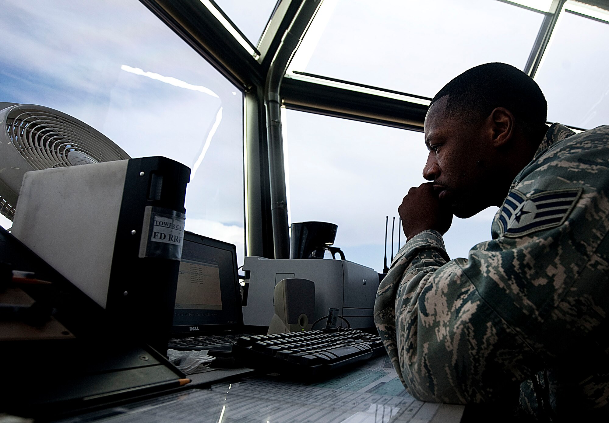 Staff Sgt. Gerald Kelley, 57th Operations Support Squadron air traffic controller, reviews data at the Control Tower Aug. 31, 2012, at Nellis Air Force Base, Nev. ATC specialists apply separation rules to keep aircraft at a safe distance from each other. (U.S. Air Force photo by Staff Sgt. Christopher Hubenthal)


