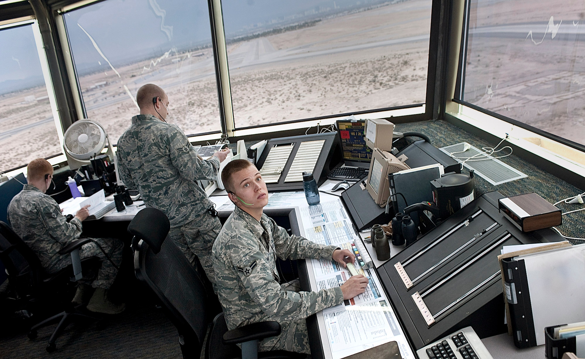 Airman 1st Class Patrick Skogen, 57th Operations Support Squadron air traffic controller, reads data on a screen to determine locations of aircraft at the control tower Aug. 31, 2012, at Nellis Air Force Base, Nev. ATC specialists manage the flow of air traffic on the ground and in 50,000 square miles of air space. (U.S. Air Force photo by Staff Sgt. Christopher Hubenthal)

