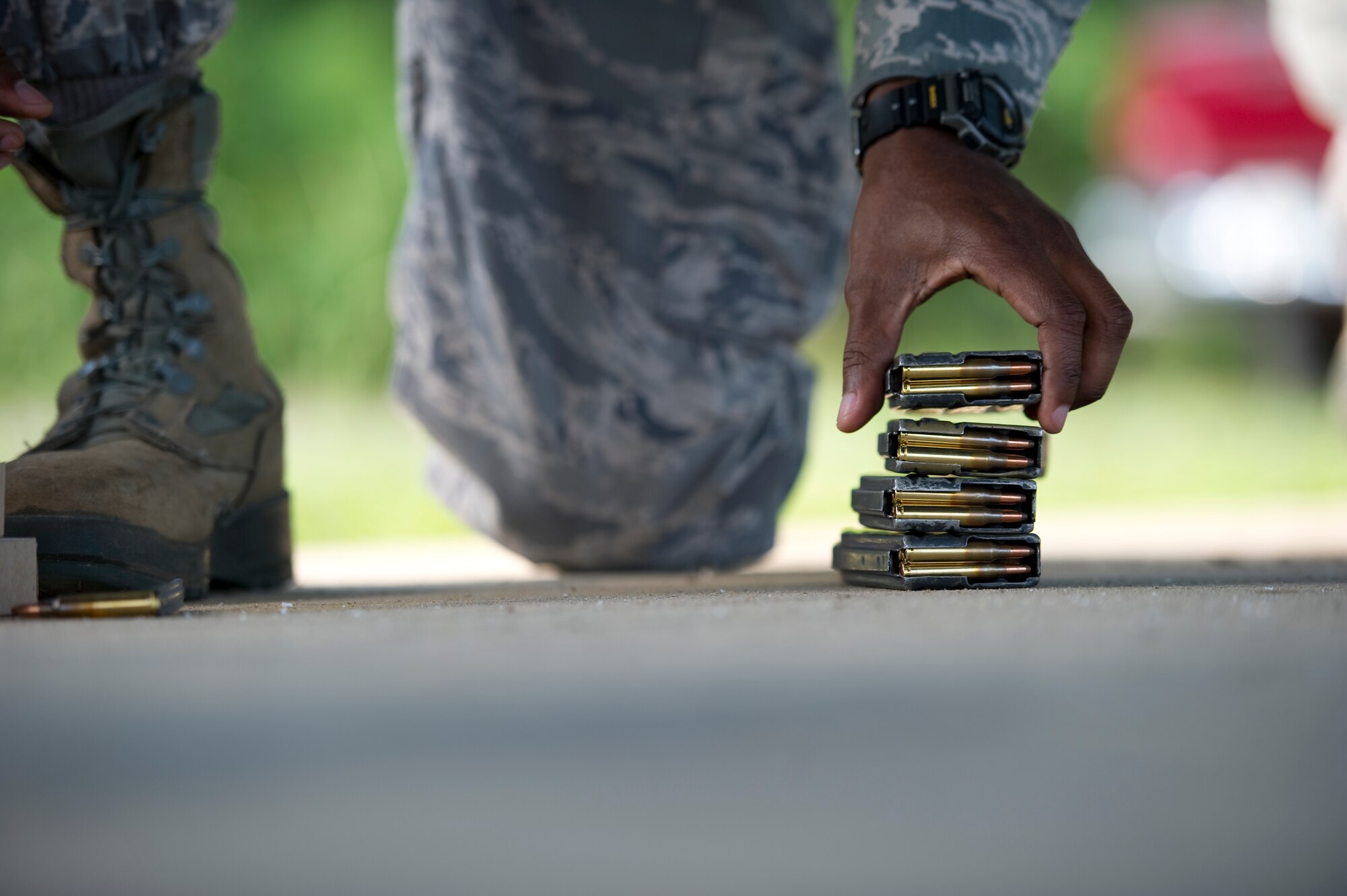 An Airman stacks rounds before weapon qualifications at the firing range on Hurlburt Field, Fla., Aug. 23, 2012.  The 1st Special Operations Security Forces Squadron Operates the small arms range, providing combat arms training and maintenance. (U.S. Air Force Photo/Airman 1st Class Naomi M. Griego)