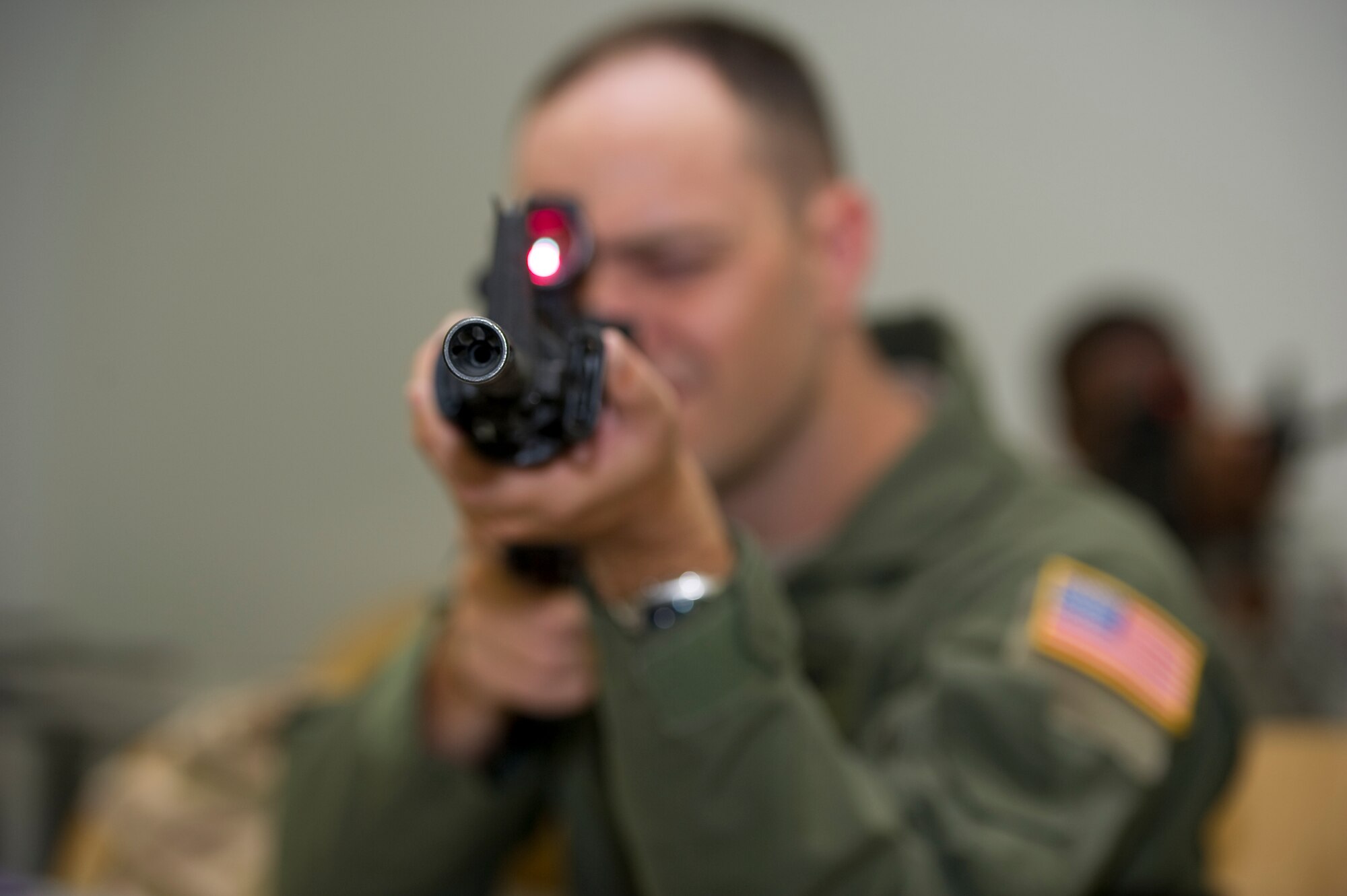 An Airman looks through the scope of his M-4 at a Combat Arms Training and Maintenance course on Hurlburt Field, Fla., Aug. 23, 2012.  CATM instructors train nearly 1,000 students each month. (U.S. Air Force Photo/Airman 1st Class Naomi M. Griego)