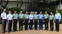 Gen. Herbert J. “Hawk” Carlisle, Pacific Air Forces commander, Lt. Gen. Cai Yingting, Deputy Chief of the General Staff of the Chinese People's Liberation Army, and U.S. and Chinese delegation members pose for a group photo in front of the eternal flame at the Courtyard of Heroes at Headquarters PACAF, Joint Base Pearl Harbor-Hickam, Hawaii, Aug. 27, 2012. Cai and his delegation visited Hawaii to discuss issues of mutual interest with senior military and defense leaders. (U.S. Air Force Photo/Tech. Sgt. Jerome S. Tayborn)