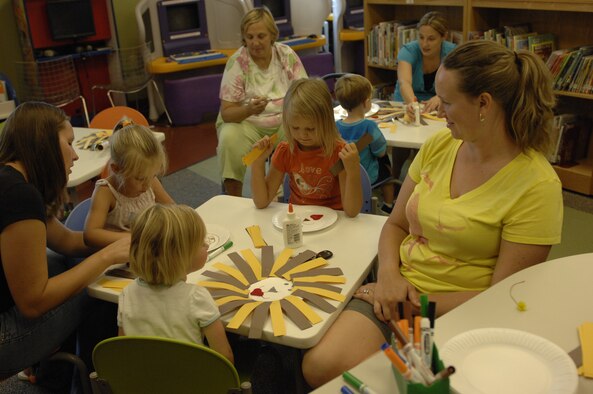 Children of servicemembers create paper lion puppets at the Shaw Air Force Base, S.C., library, Aug. 29, 2012. Every week, library staff read to the children and hold an arts and crafts session from 11 a.m. to 12 p.m. and from 1 to 2 p.m. Next week, Terra Zeigler, a children’s book author, is scheduled to read to the children. (U.S. Air Force photo by Airman 1st Class Krystal M. Jeffers/Released)