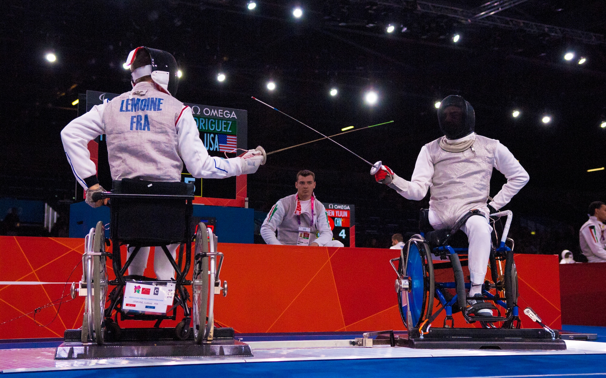 Former Air Force Staff Sgt. Mario Rodriguez, right, a member of the 2012 U.S. Paralympic fencing team, squares off with France's Ludov LeMoine at London's ExCel Centre during the Paralympic Games, Sept. 4, 2012. (DOD photo/Sgt. 1st Class Tyrone C. Marshall Jr.)