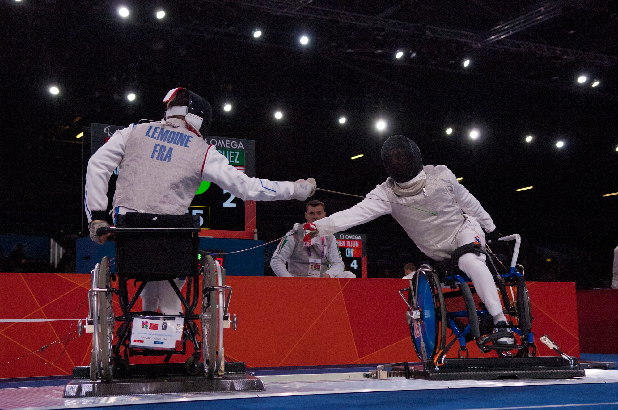 Former Air Force Staff Sgt. Mario Rodriguez, right, a member of the 2012 U.S. Paralympic fencing team, engages France's Ludov LeMoine during a bout at London's ExCel Centre during the Paralympic Games, Sept. 4, 2012. (DOD photo/Sgt. 1st Class Tyrone C. Marshall Jr.)  

