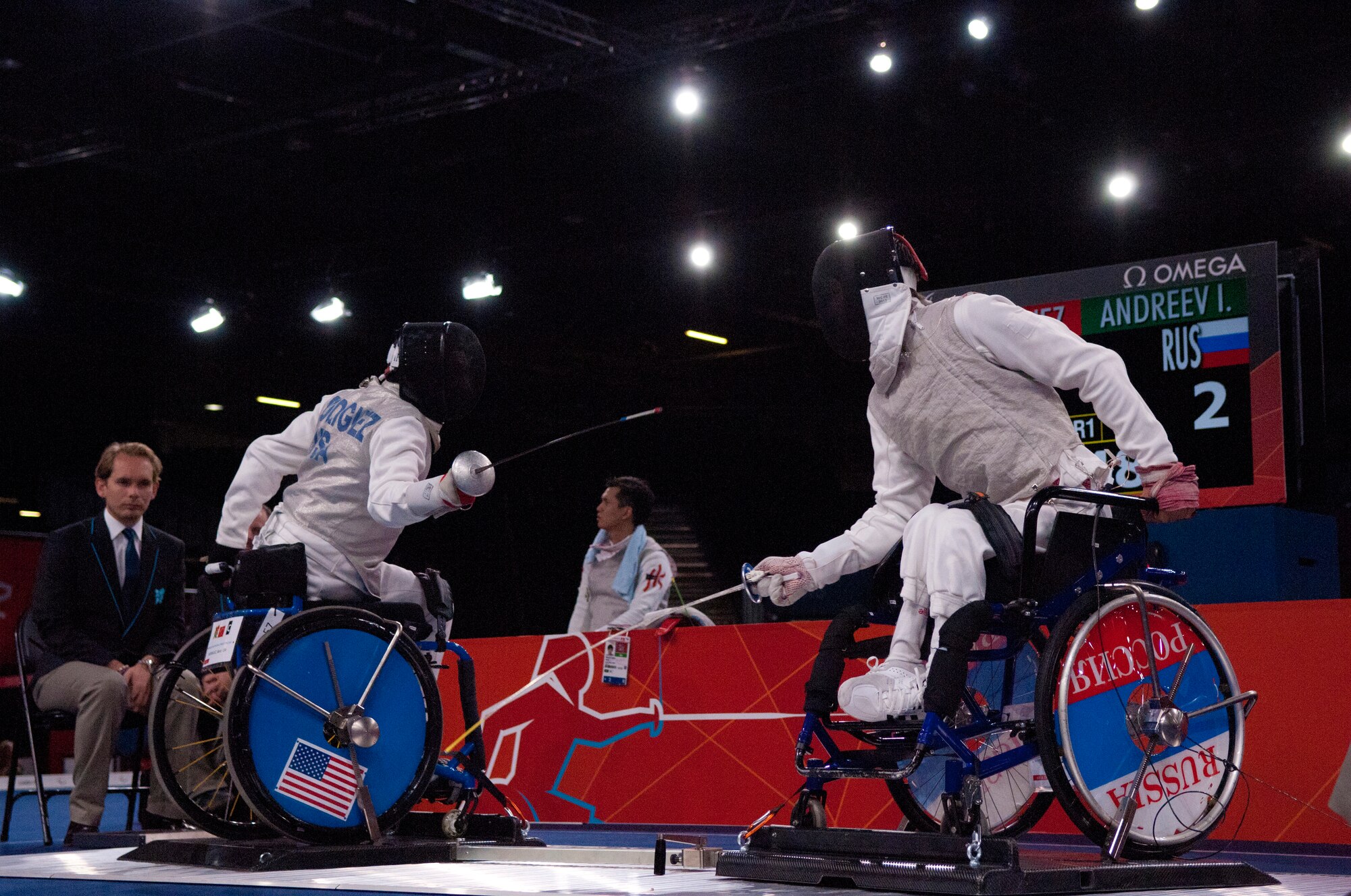 Former Air Force Staff Sgt. Mario Rodriguez, left, a member of the 2012 U.S. Paralympic fencing team, battles Russia's Ivan Andreev at London's ExCel Centre during the Paralympic Games, Sept. 4, 2012. (DOD photo/Sgt. 1st Class Tyrone C. Marshall Jr.)  
