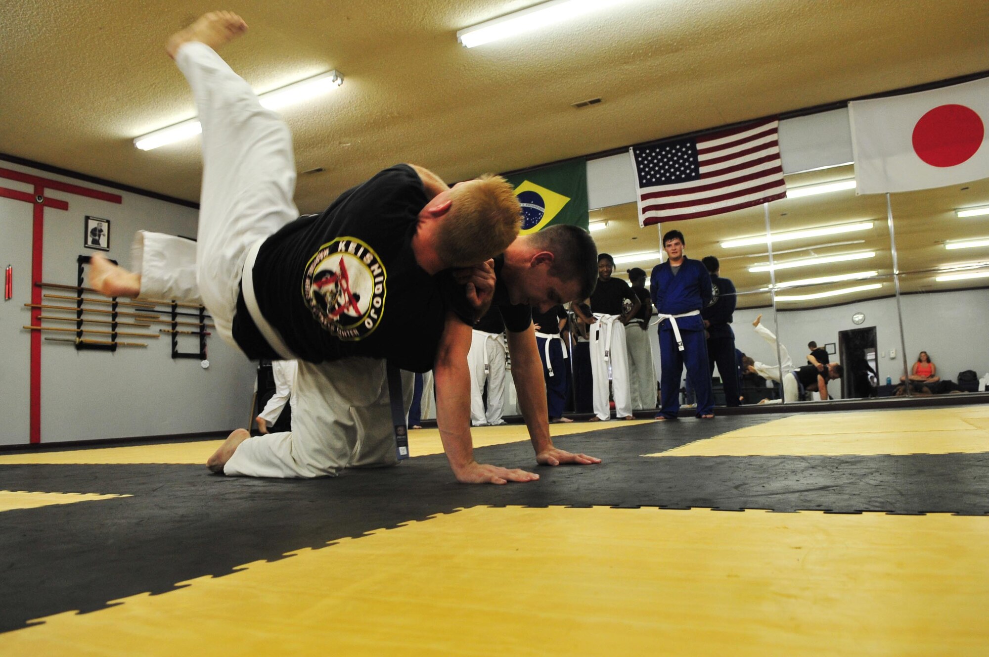 Students from the Keishidojo Martial Arts and Fitness Center work on combative techniques in Sumter, S.C., Aug. 21, 2012. There are various martial arts styles offered, as well as self-defense classes which Keishidojo martial arts center welcomes military members to take part in. (U.S. Air Force photo by Airman 1st Class Ashley L. Gardner/ Released)