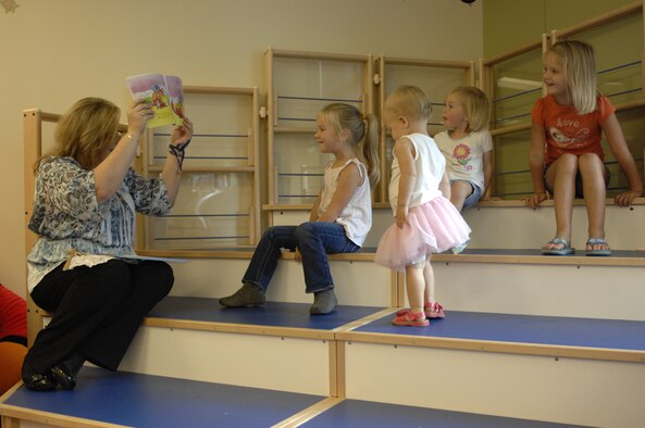 Marie Stanley, the children's program coordinator for the base library, reads “Clifford at the Circus” to children at Shaw Air Force Base, S.C., Aug. 29, 2012. Afterwards, the children were read “The Circus Ship” and created paper lion puppets. Next week, Terra Zeigler, a children’s book author, is scheduled to read to the children from 11 a.m. to 12 p.m. and from 1 to 2 p.m. (U.S. Air Force photo by Airman 1st Class Krystal M. Jeffers/Released)