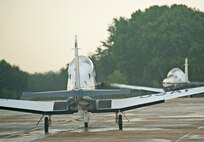 T-6 Texan IIs from the 479th Flying Training Group at Naval Air Station Pensacola, Fla., taxi out for departure to their home station, August 31, 2012.  The aircraft had evacuated to JBSA-Randolph in anticipation of Hurricane Isaac. (U.S. Air Force photo by Benjamin Faske)